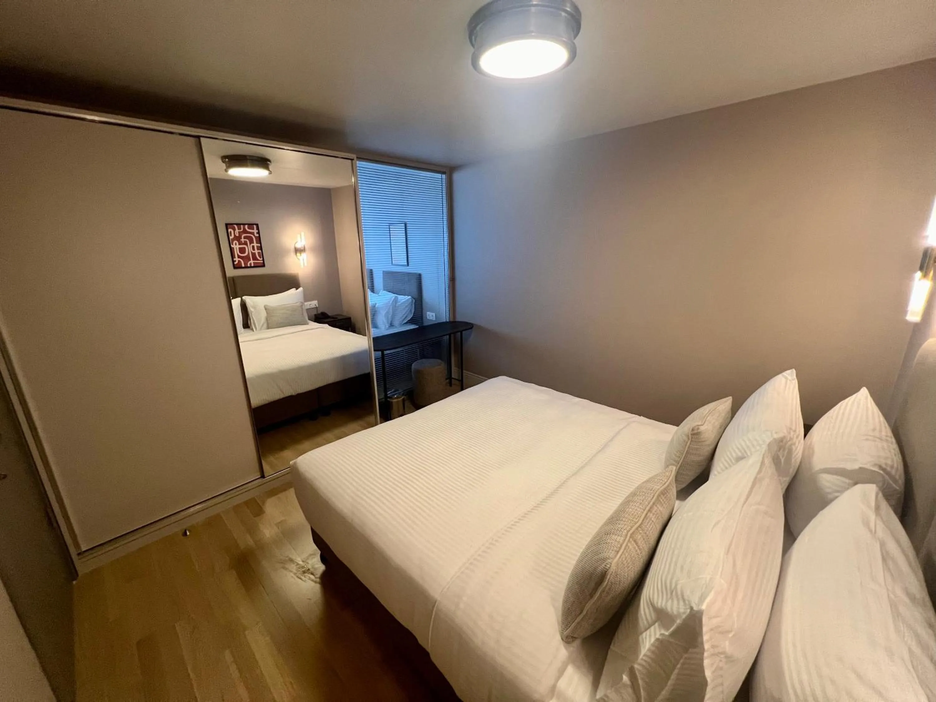 Bed in Weingart Suites Hotel