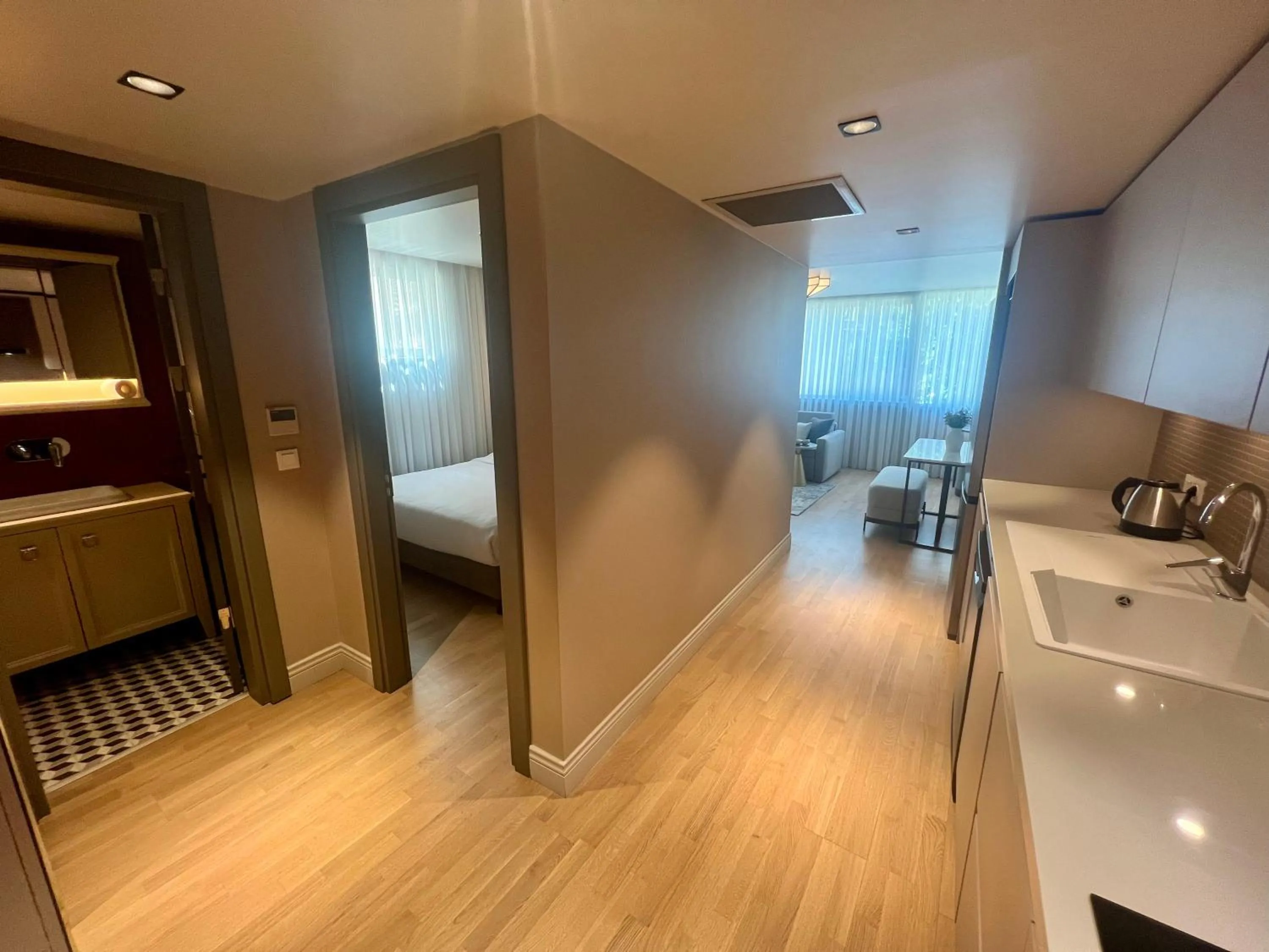 Bed in Weingart Suites Hotel