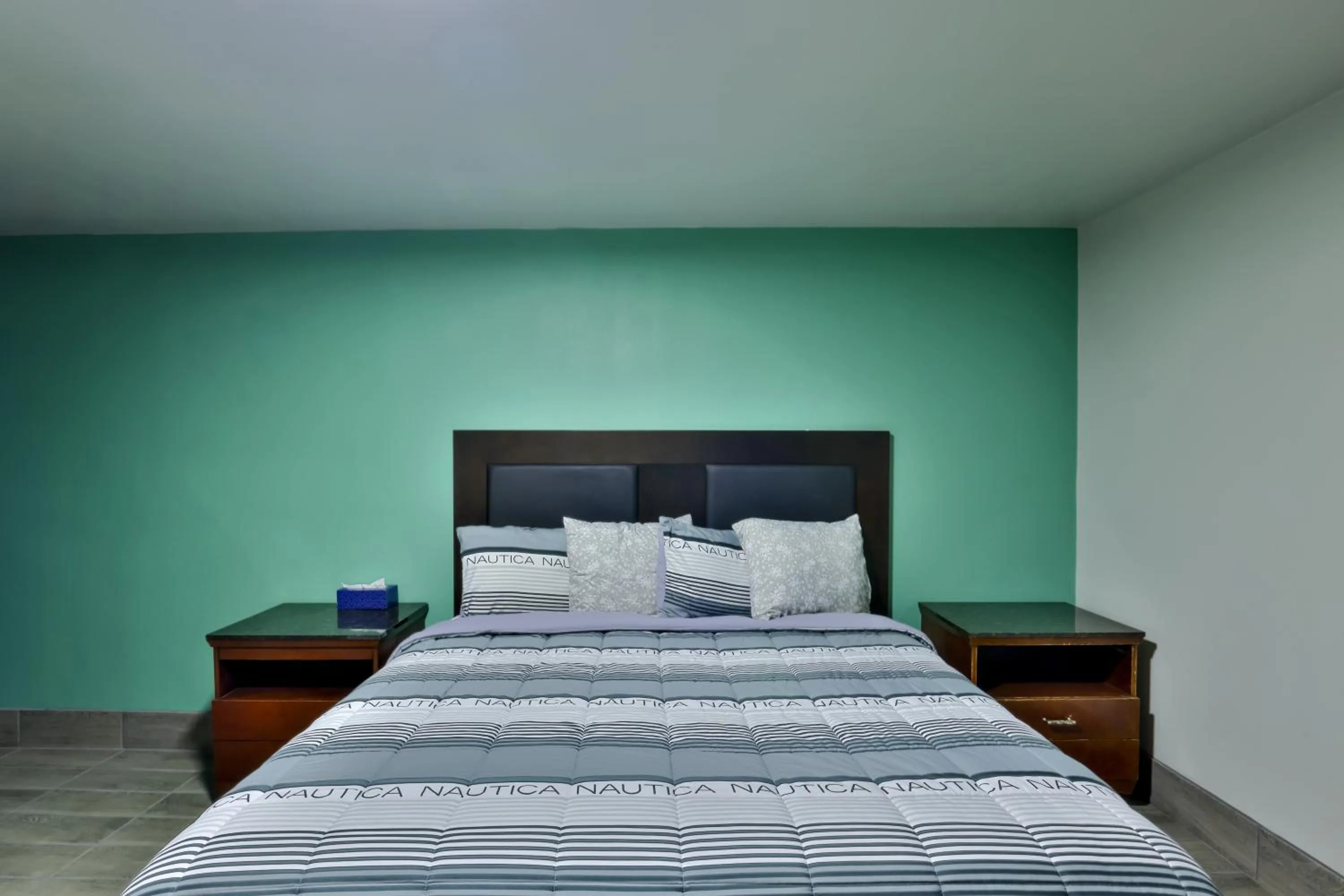 Bed in EL TEJAS MOTEL