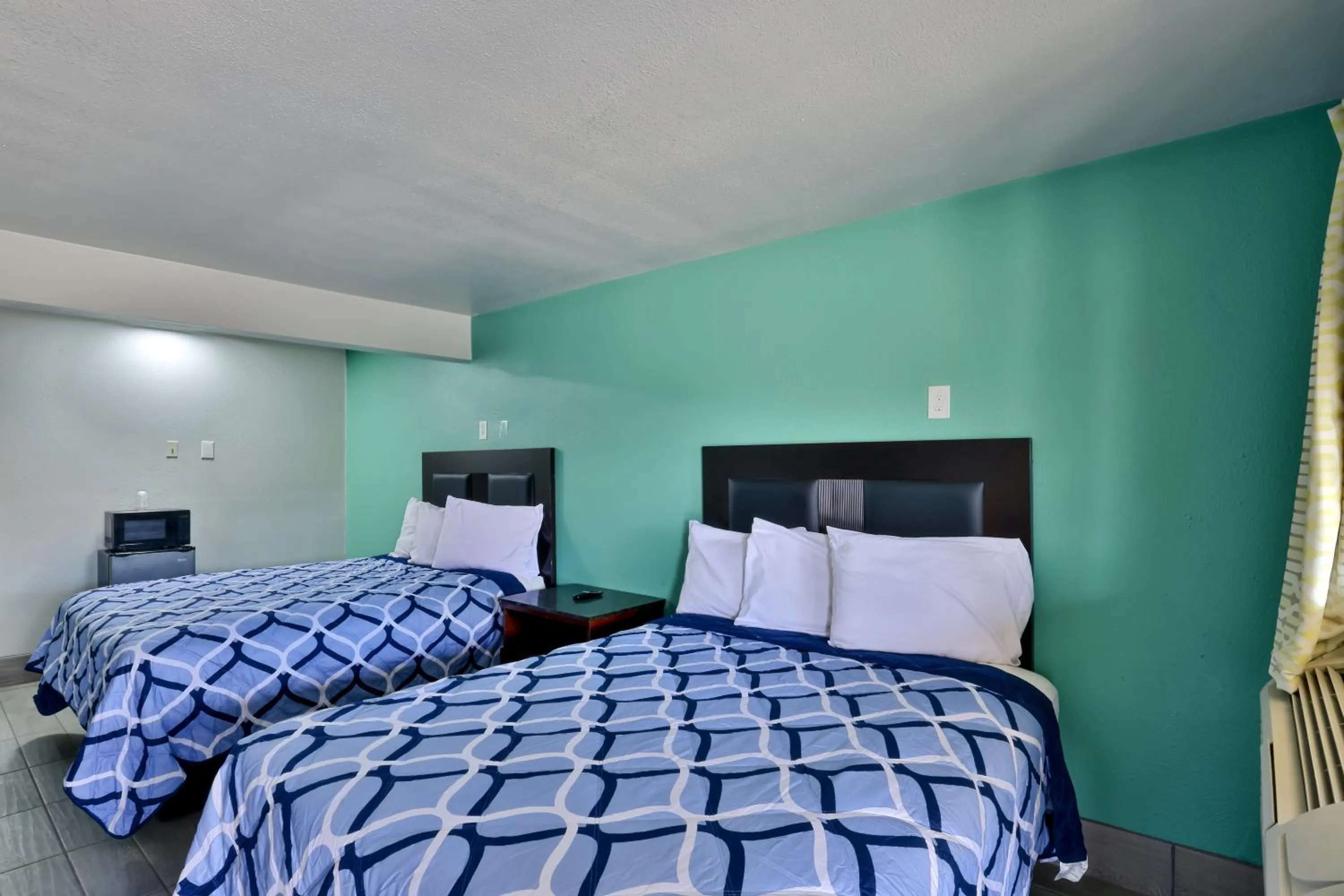 Bed in EL TEJAS MOTEL