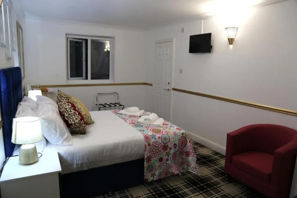 Bedroom in OYO 4 Sisters Inn