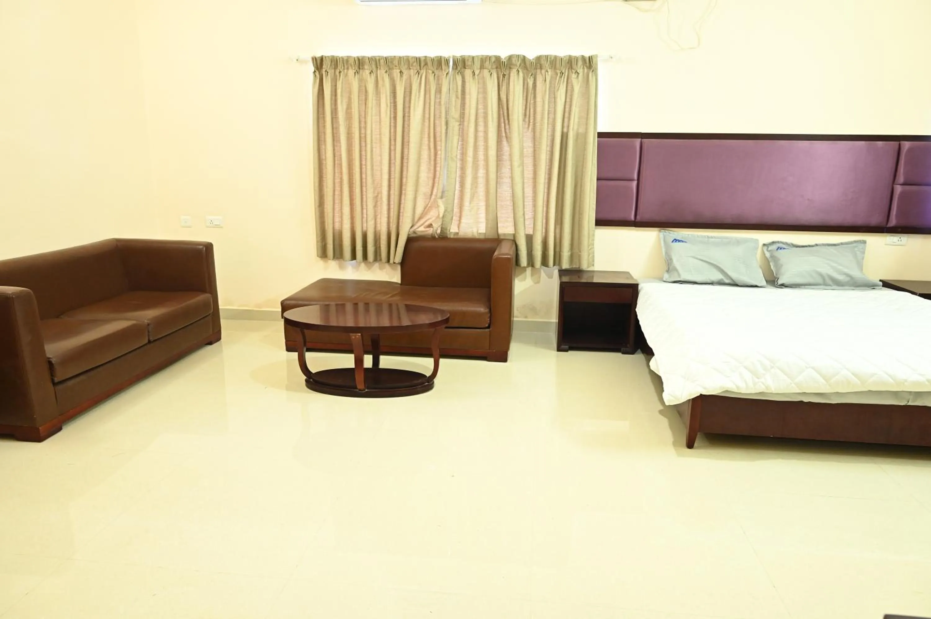 Bed in Athithi Resorts