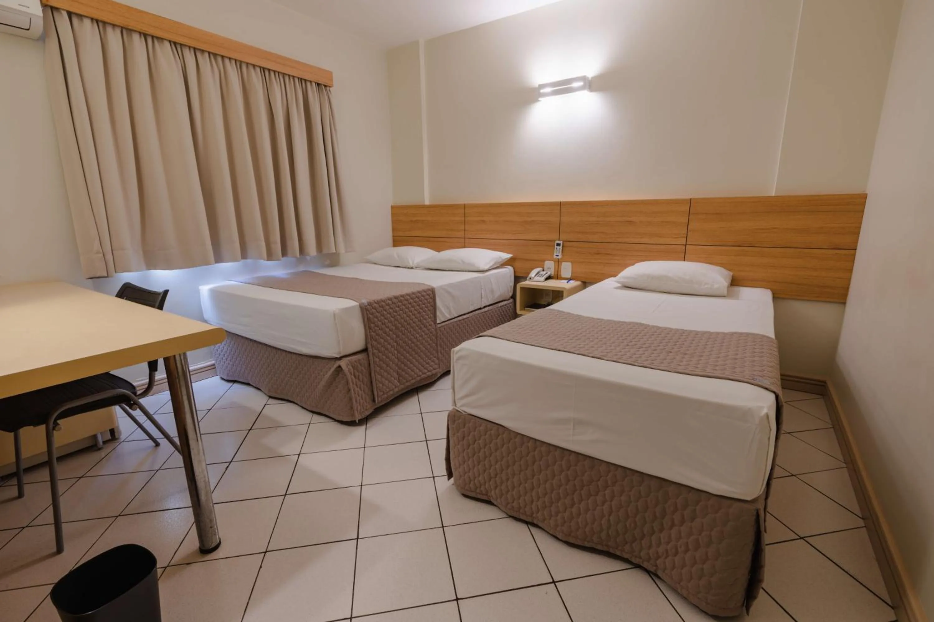 Bed in Hotel Caiuá Express Umuarama