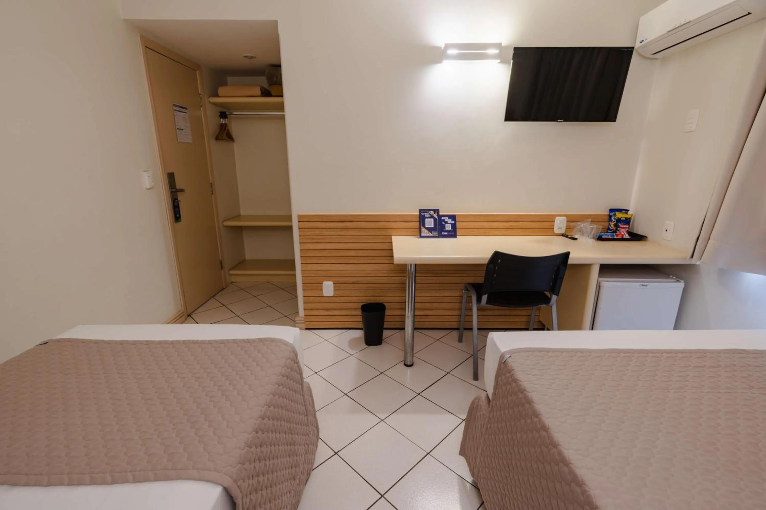 Bed in Hotel Caiuá Express Umuarama