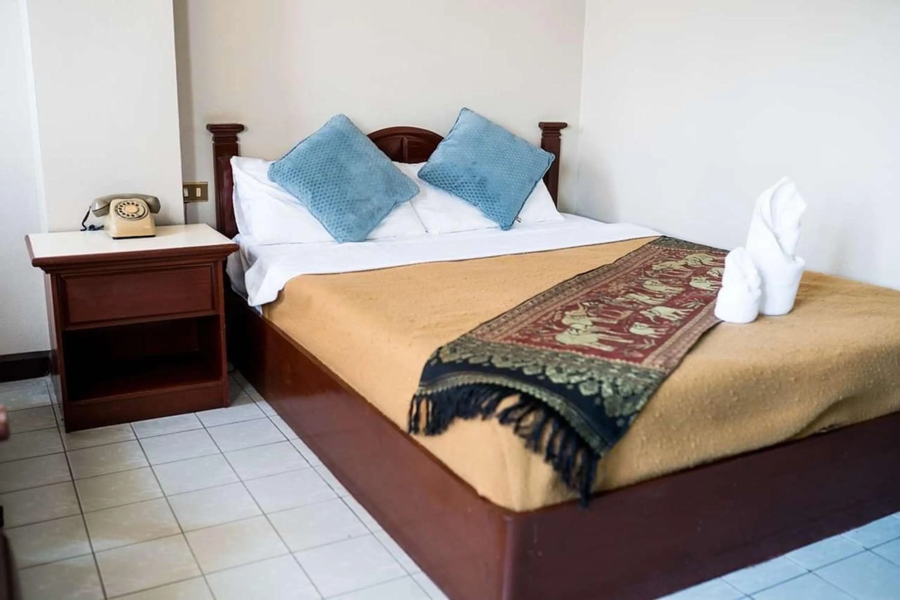 Bed in Khelang Nakorn Hotel