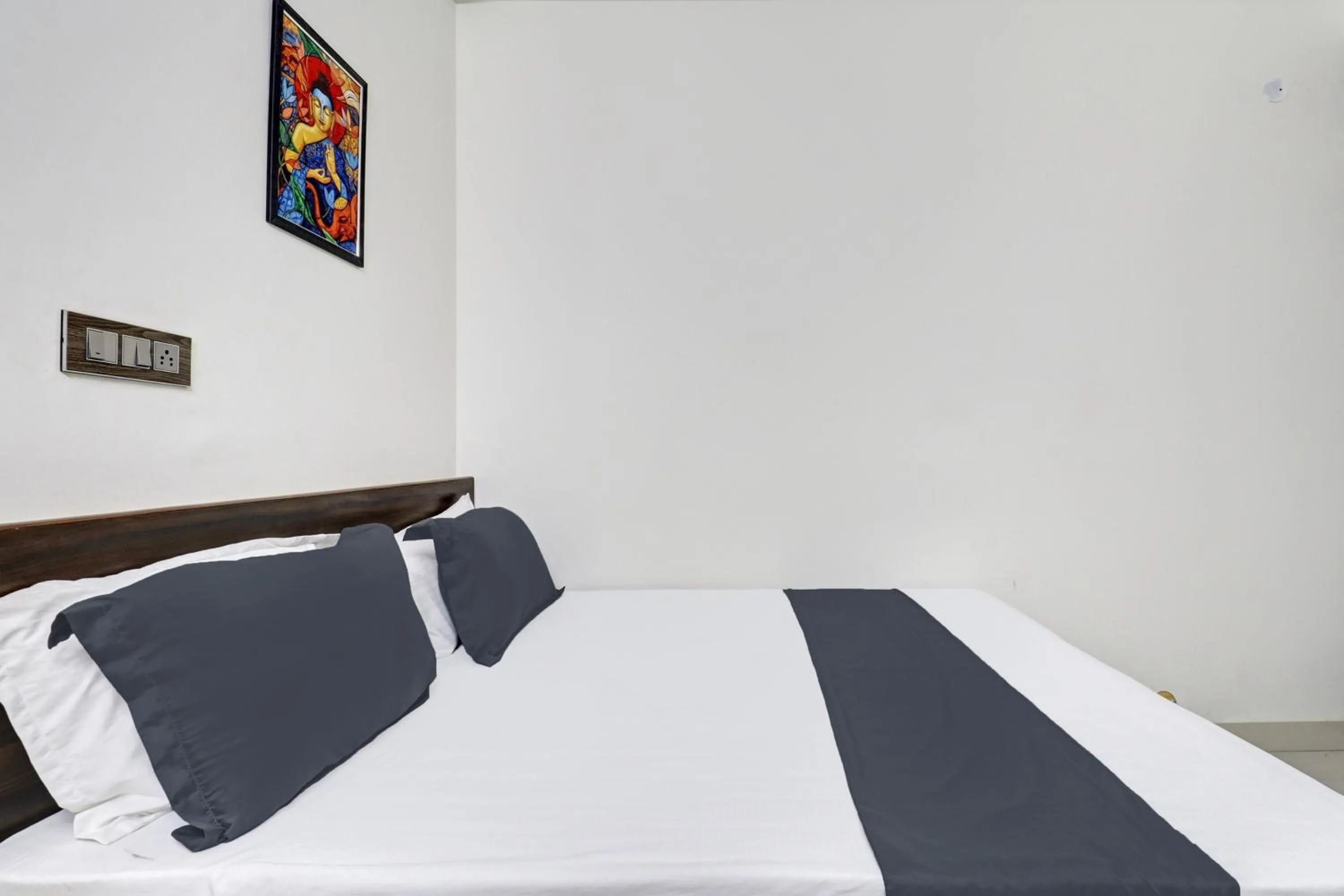 Bedroom in Hotel O J.K. Suites & Rooms