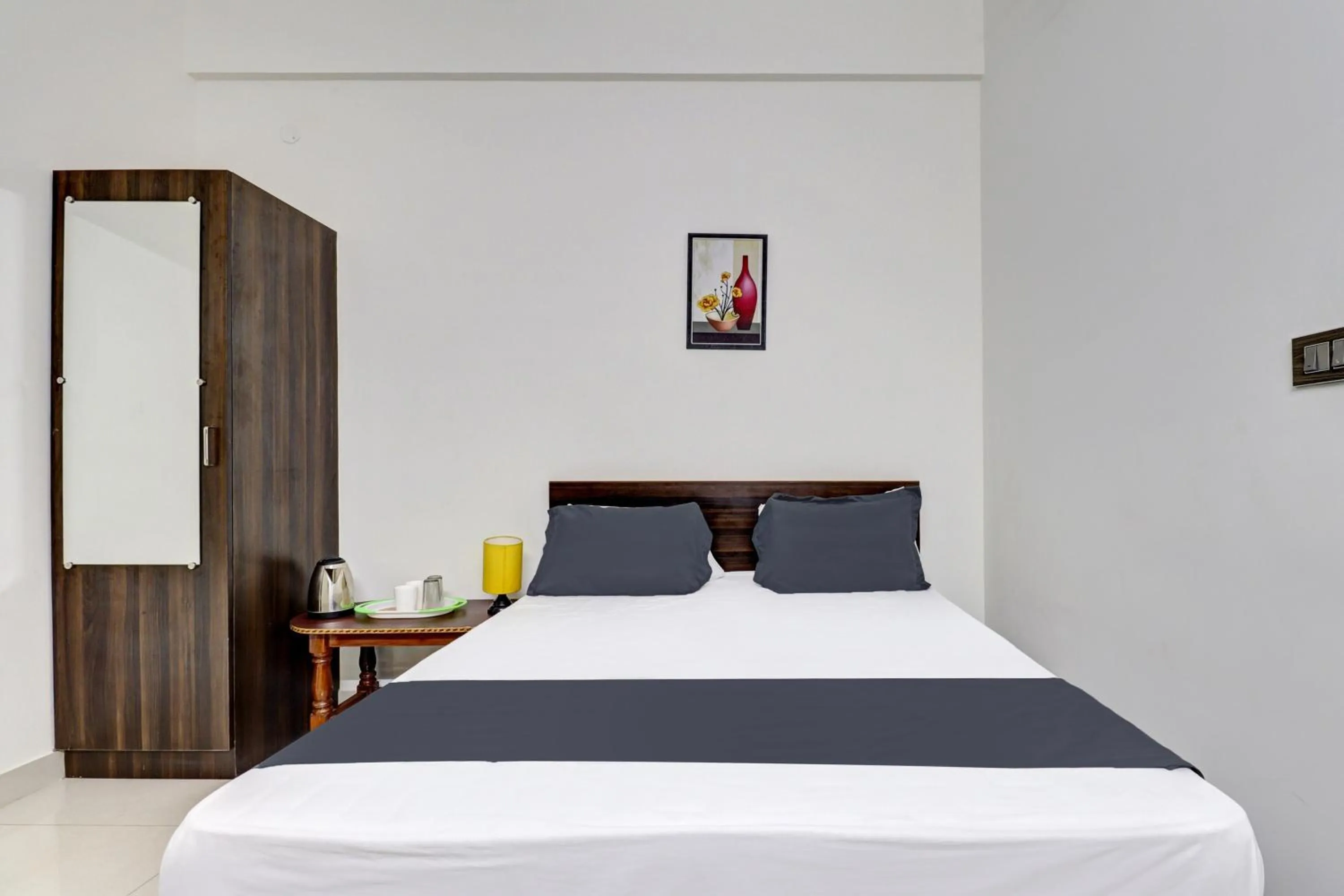 Bedroom in Hotel O J.K. Suites & Rooms