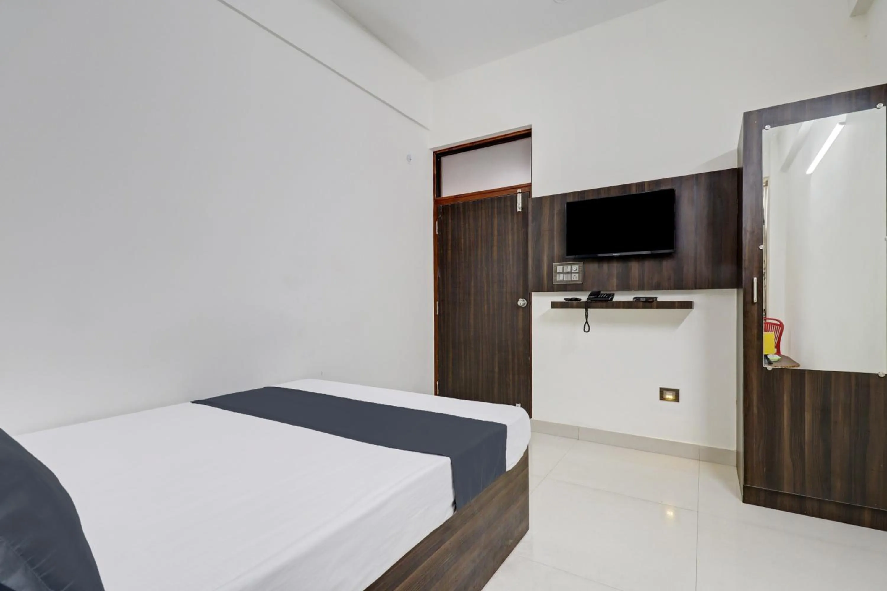 Bedroom in Hotel O J.K. Suites & Rooms