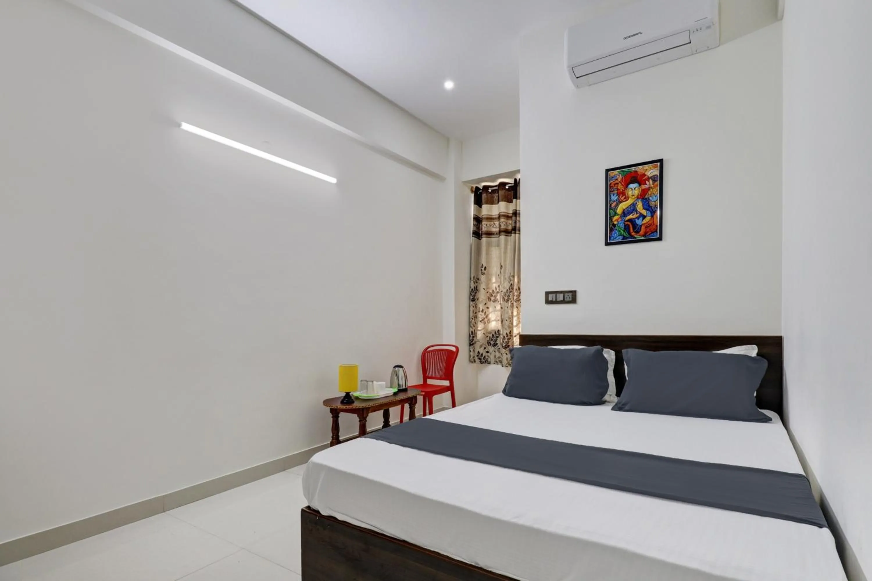 Bedroom in Hotel O J.K. Suites & Rooms