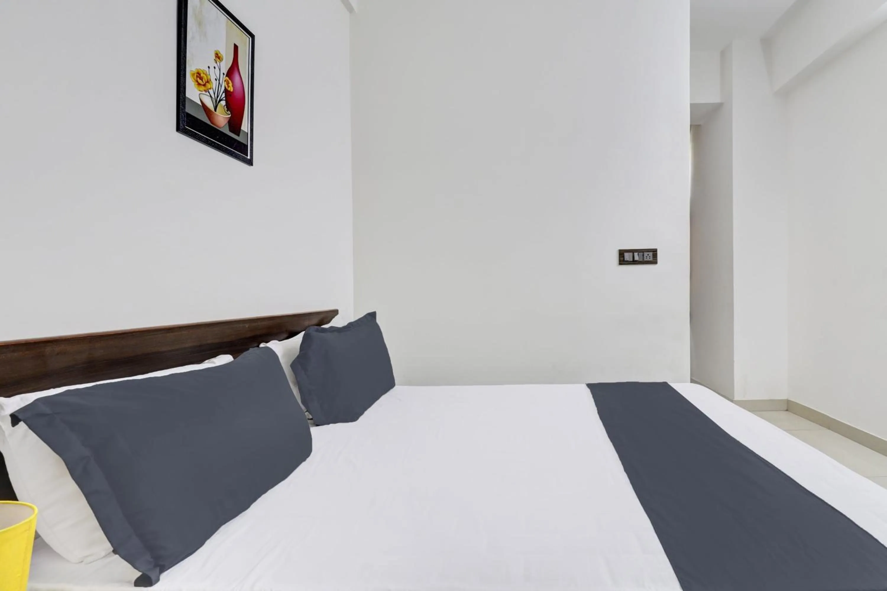 Bedroom in Hotel O J.K. Suites & Rooms