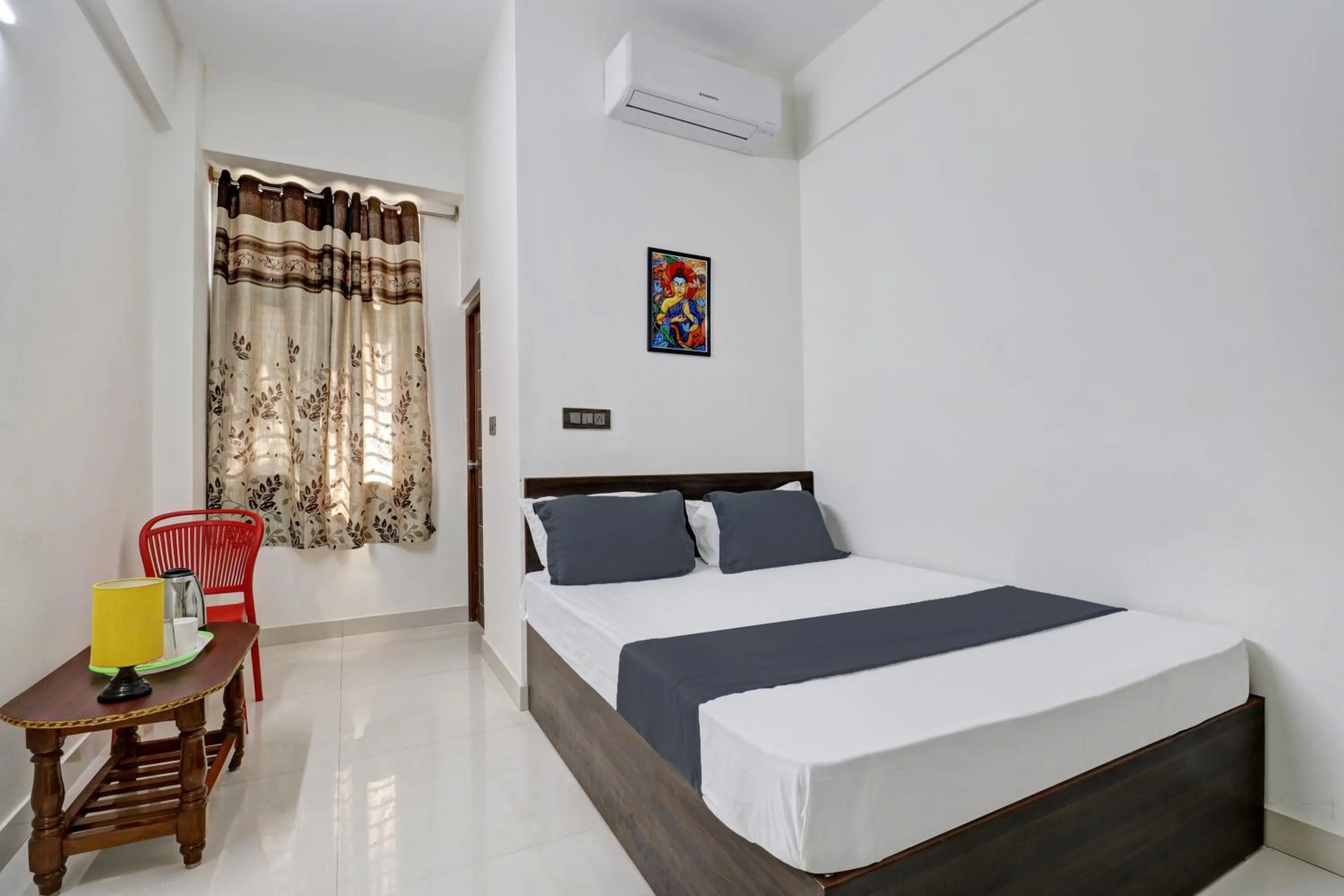 Bedroom in Hotel O J.K. Suites & Rooms