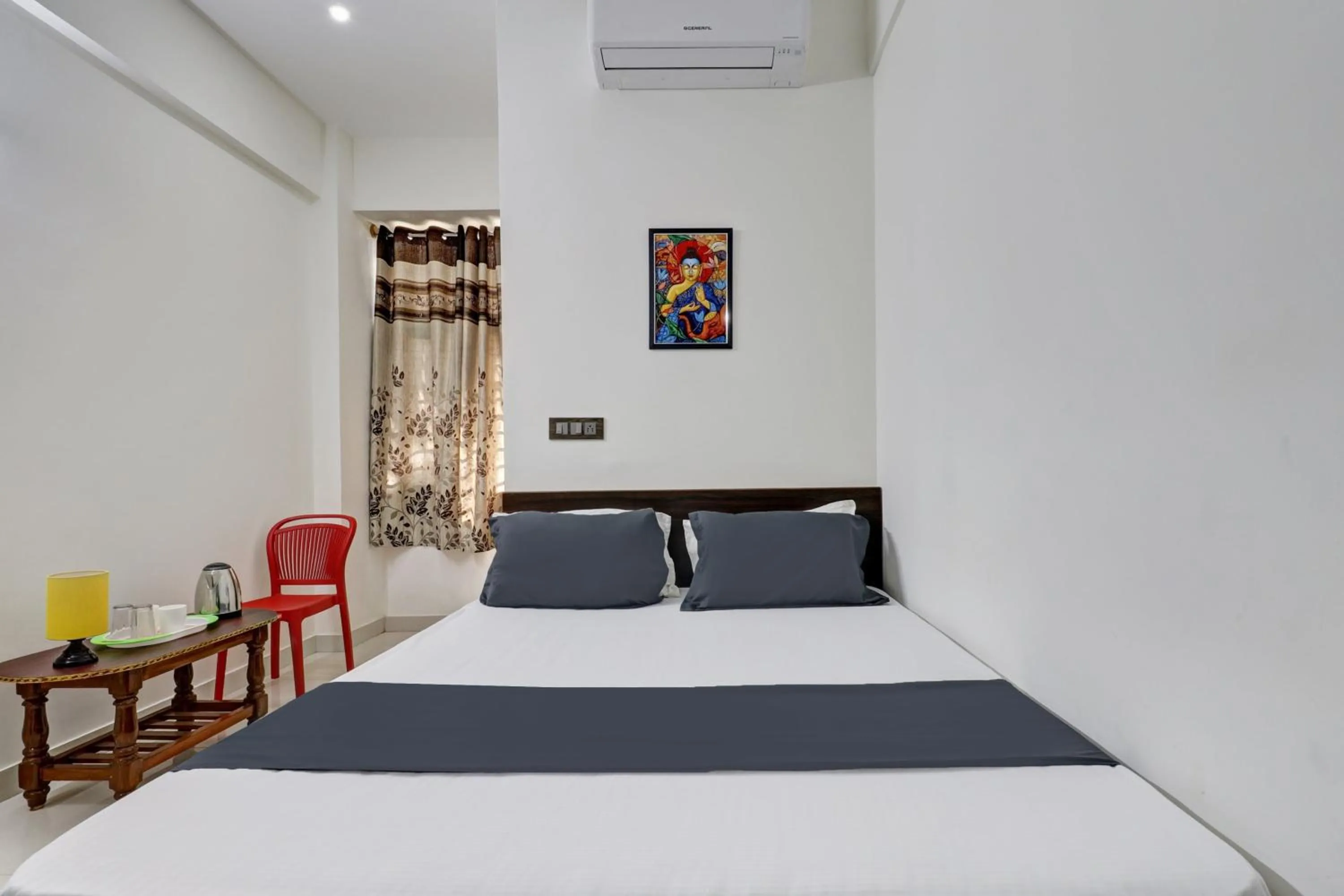 Bedroom in Hotel O J.K. Suites & Rooms