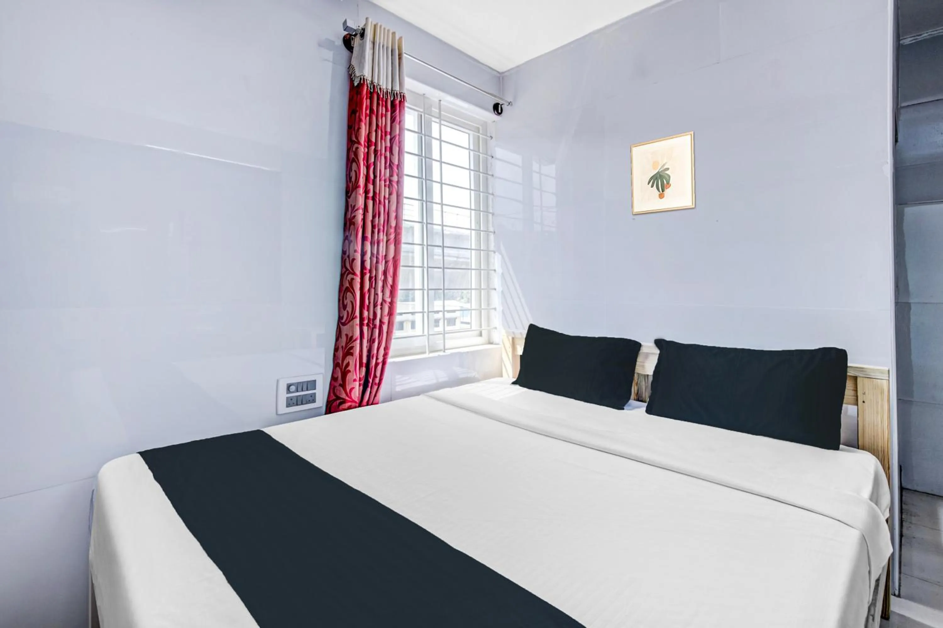 Bedroom in Collection O Sapthagiri Inn