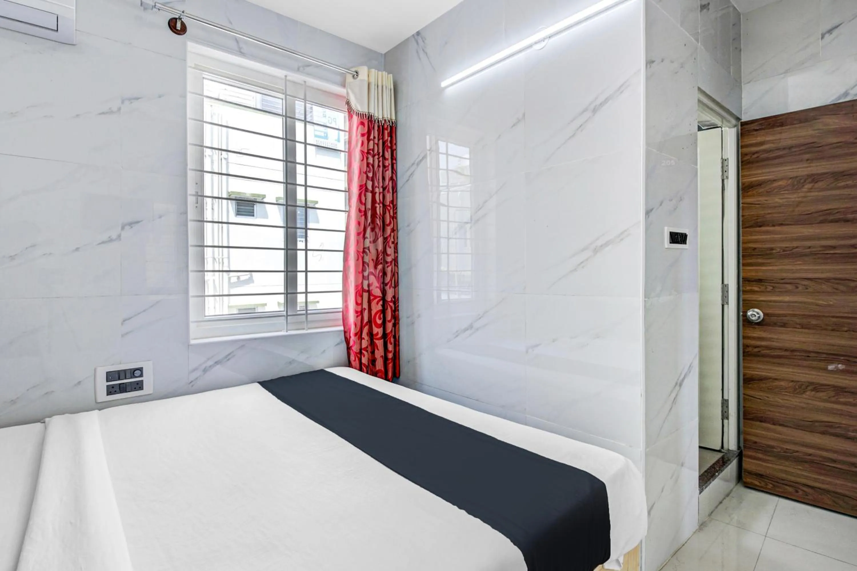 Bedroom in Collection O Sapthagiri Inn