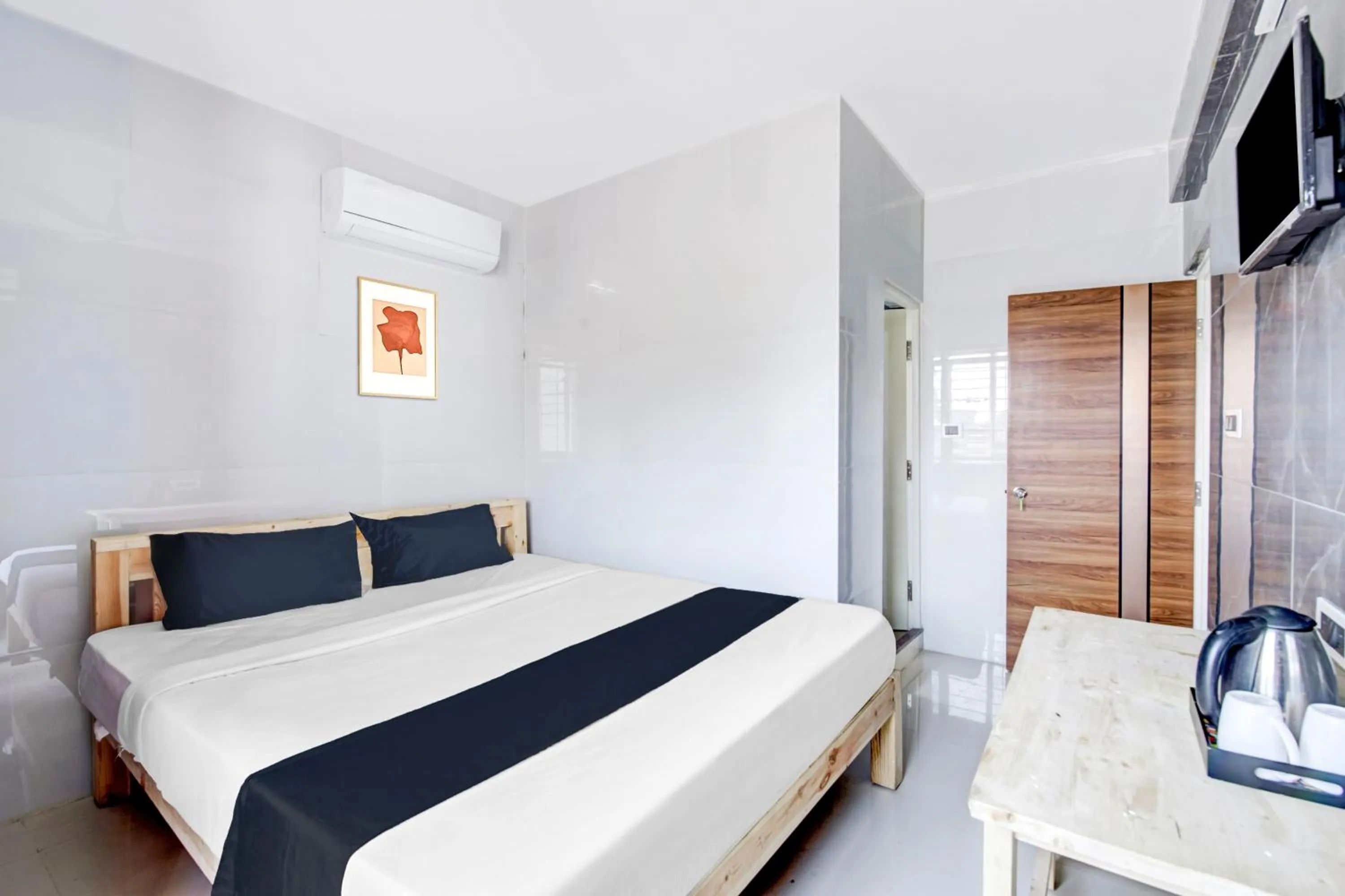 Bedroom in Collection O Sapthagiri Inn