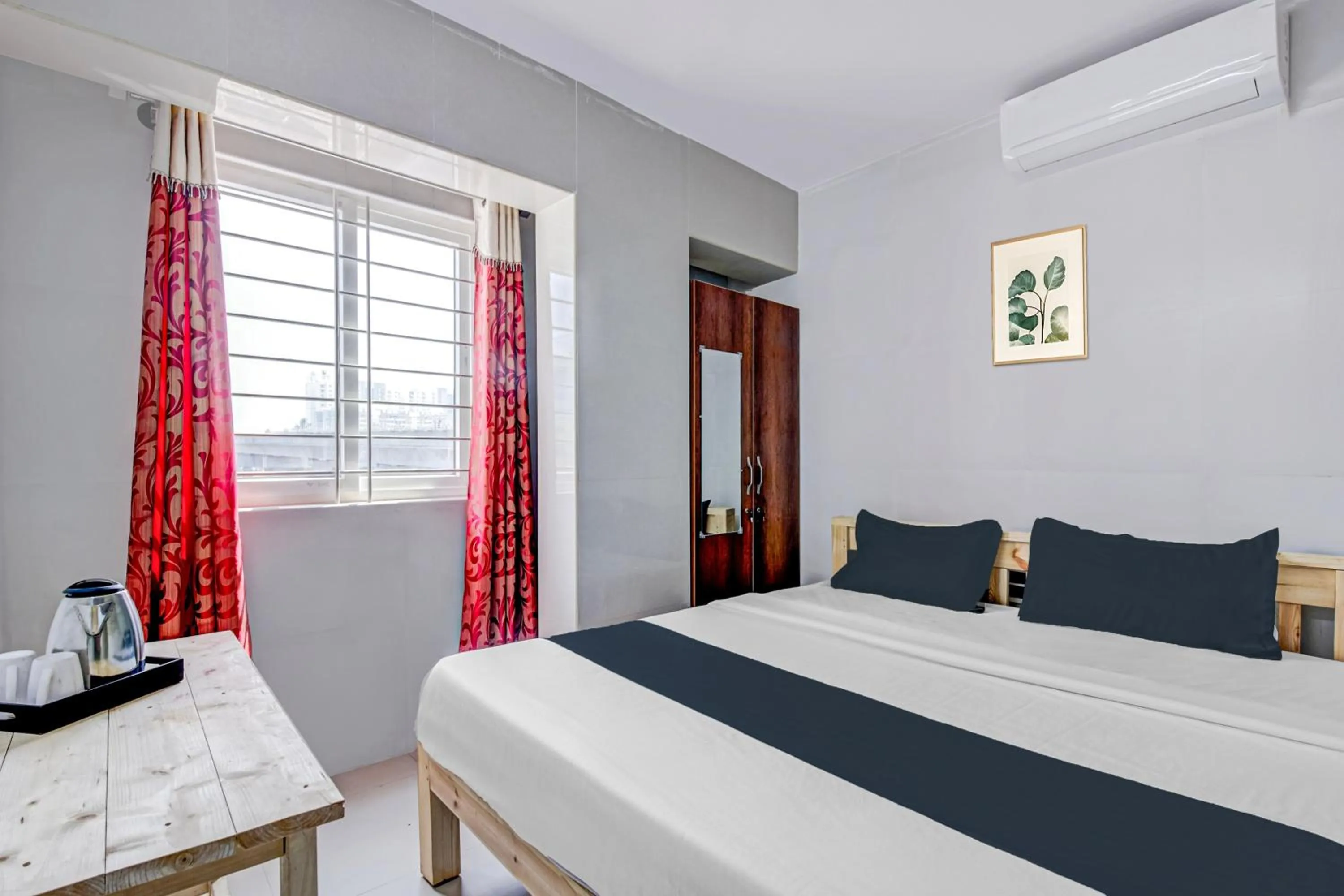 Bedroom in Collection O Sapthagiri Inn