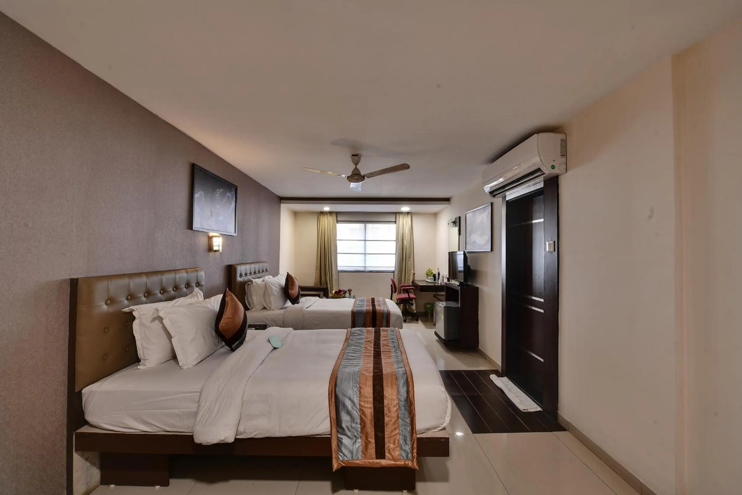 Bed in Click Hotel Yuvraj