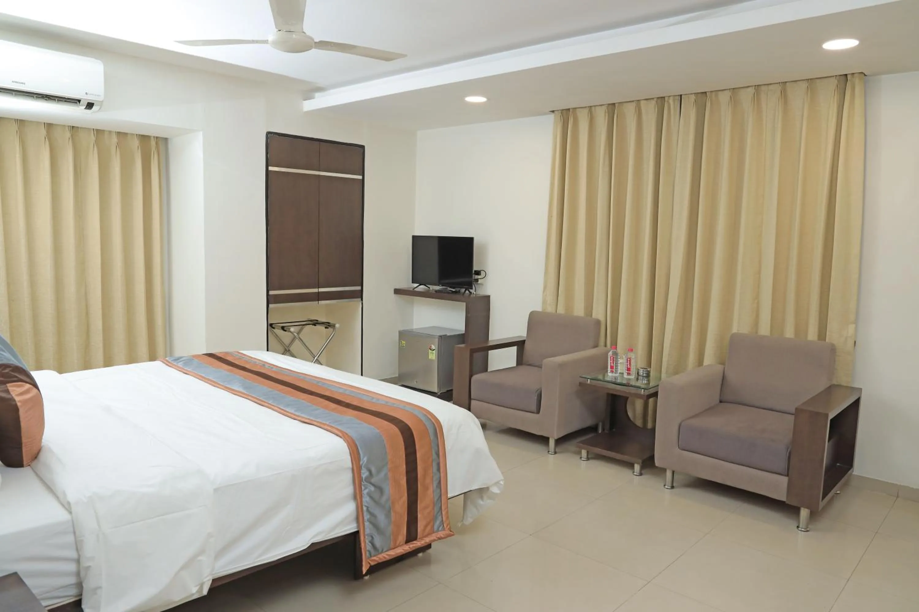 Bed in Click Hotel Yuvraj