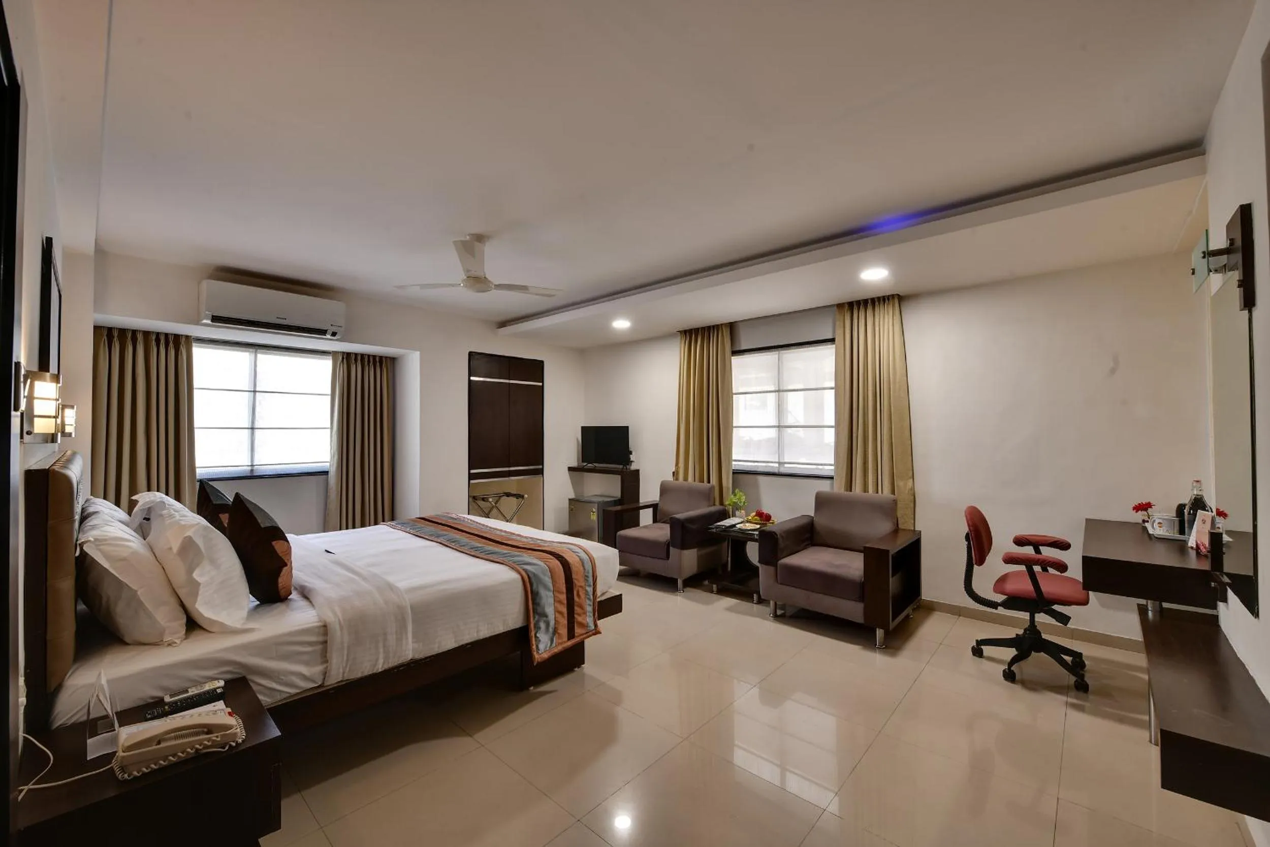 Bed in Click Hotel Yuvraj