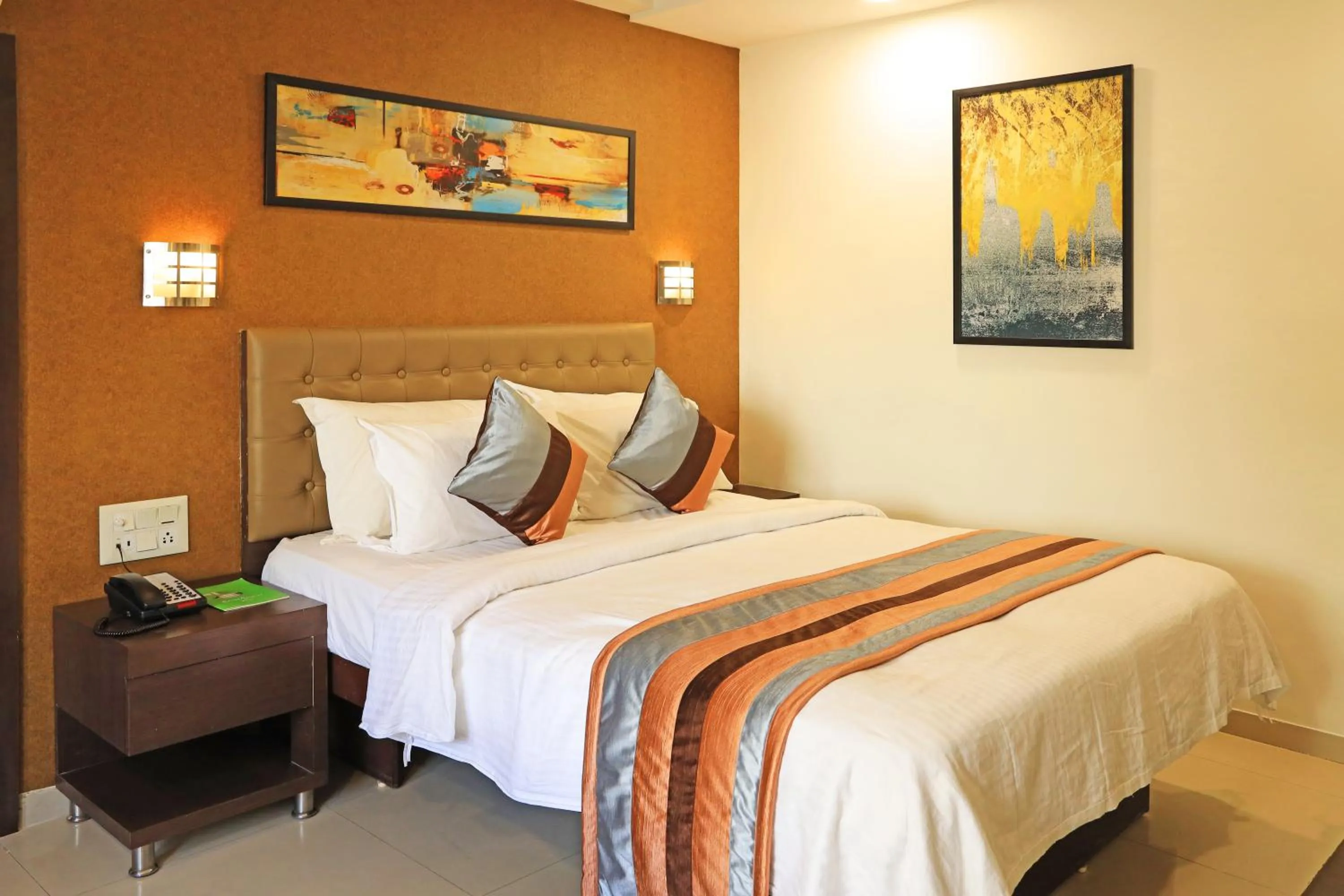 Bed in Click Hotel Yuvraj