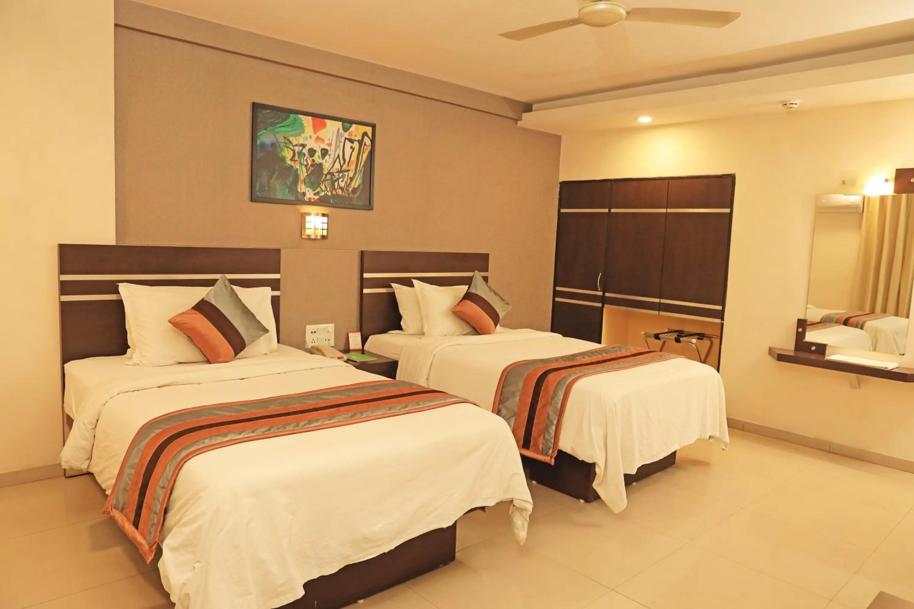 Bed in Click Hotel Yuvraj