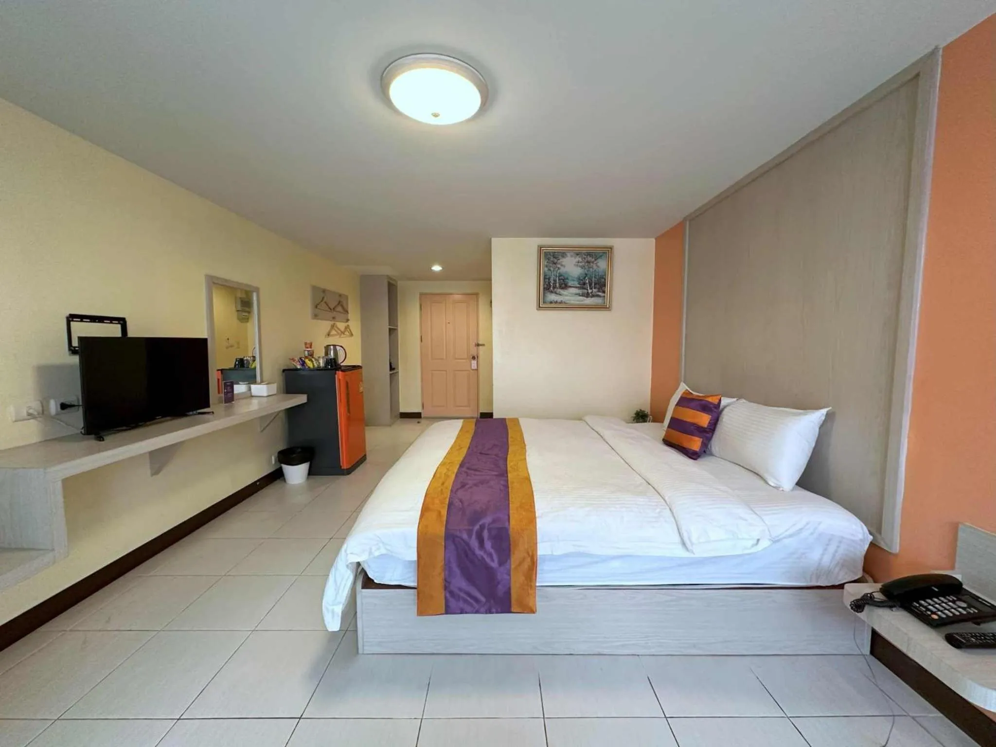 Bed in Aryan Suites Hotel