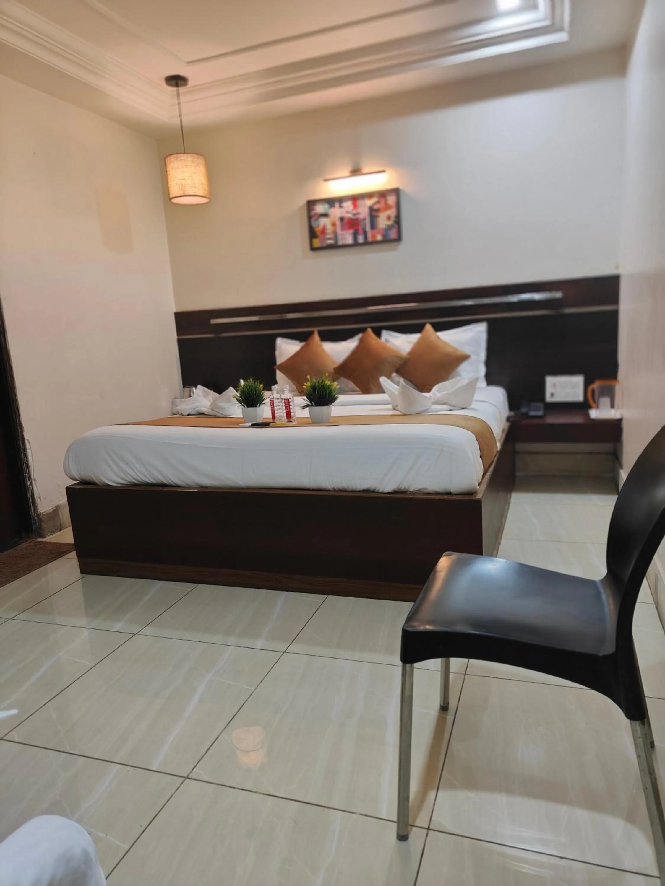 Photo of the whole room, Bed in Hotel Shirdi Park Inn 80 Meters From Sai Samadhi Temple