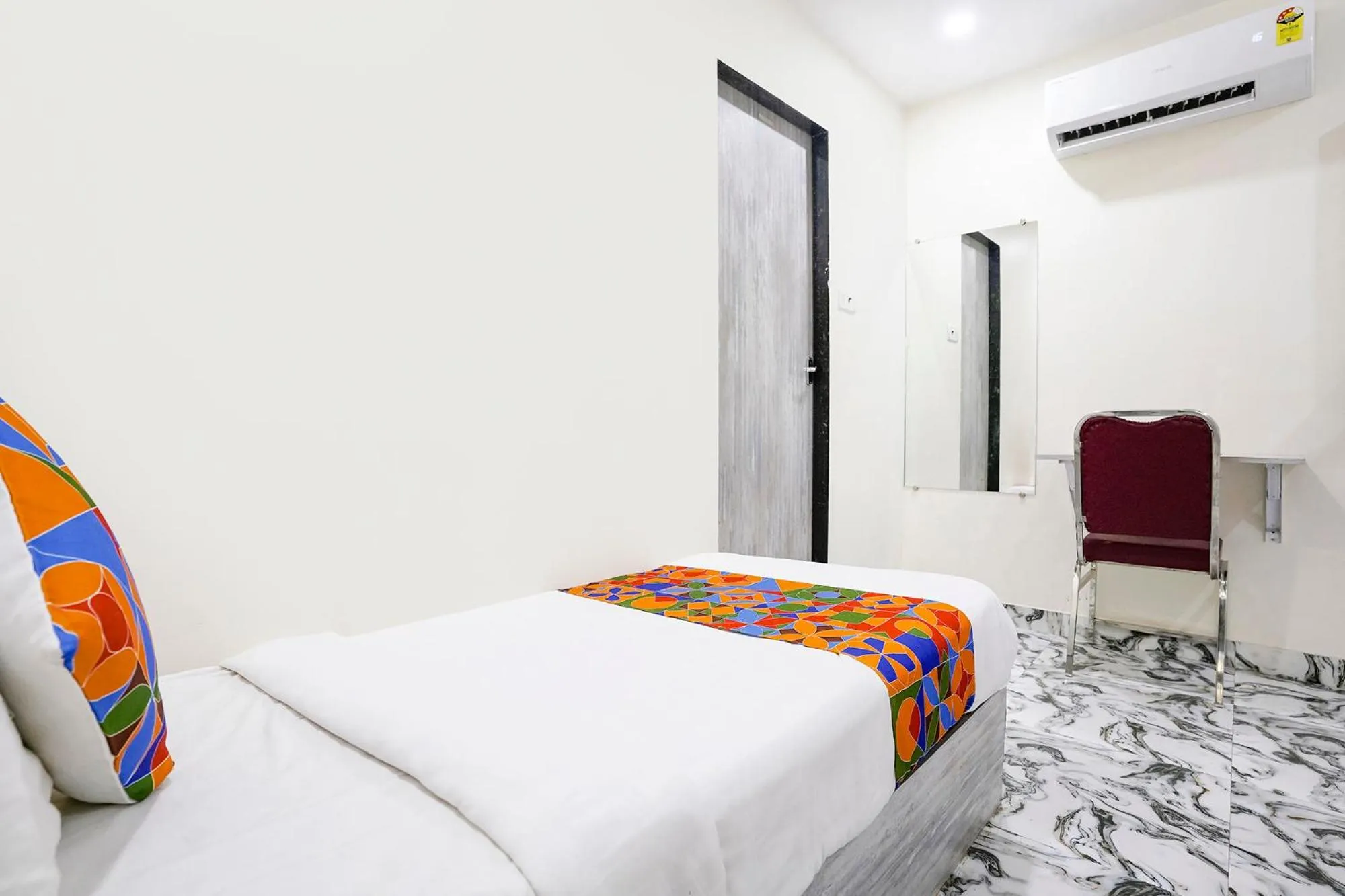 Bed in FabHotel Good Luck Residency