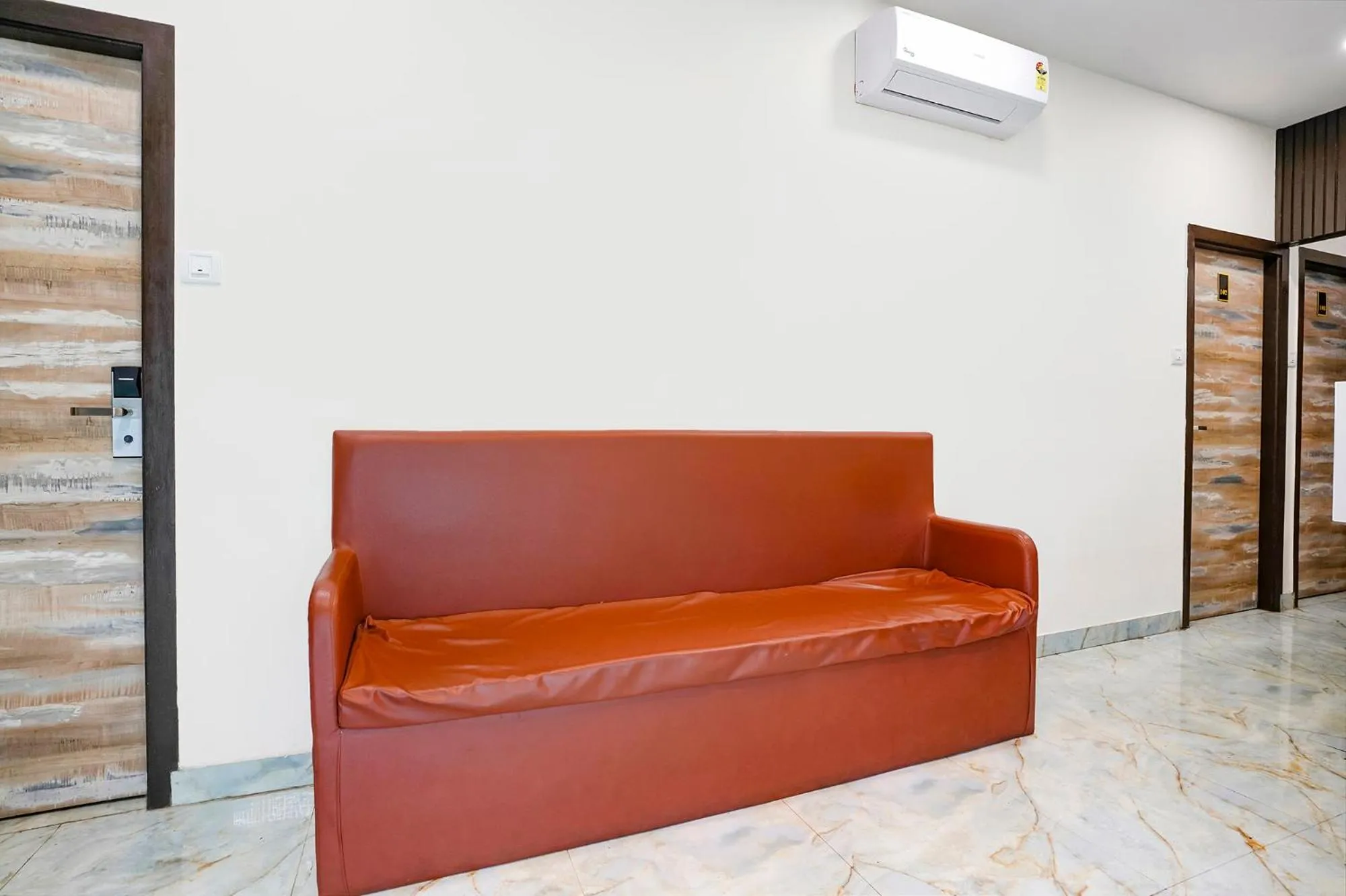 Seating area in FabHotel Good Luck Residency