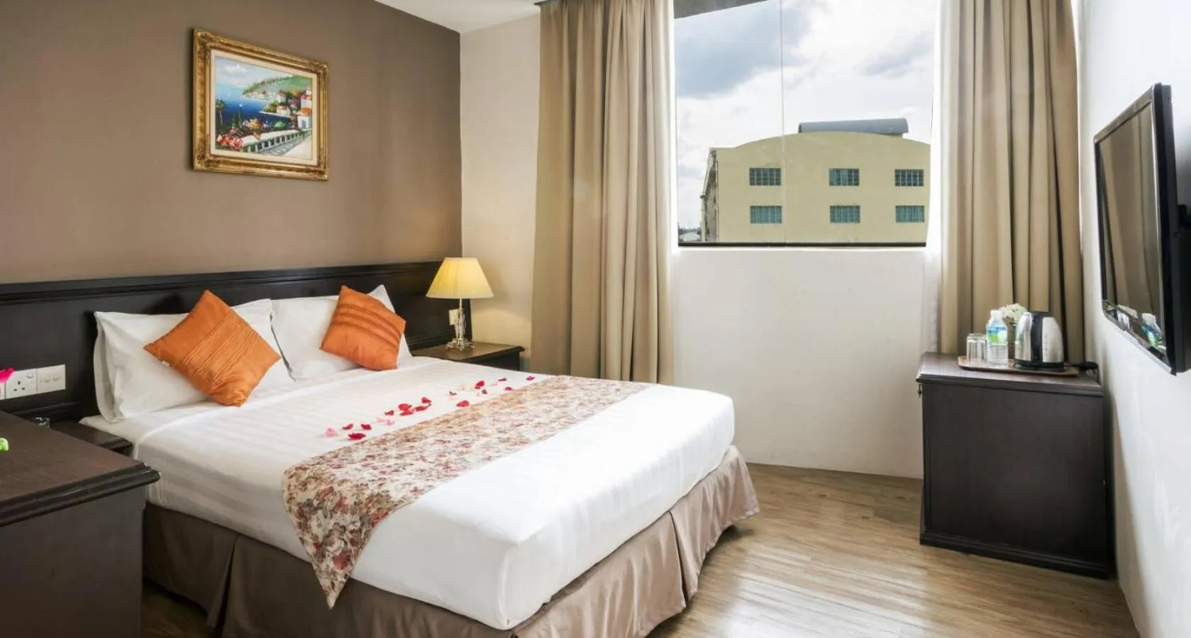 Bed in PJ De Inn Hotel