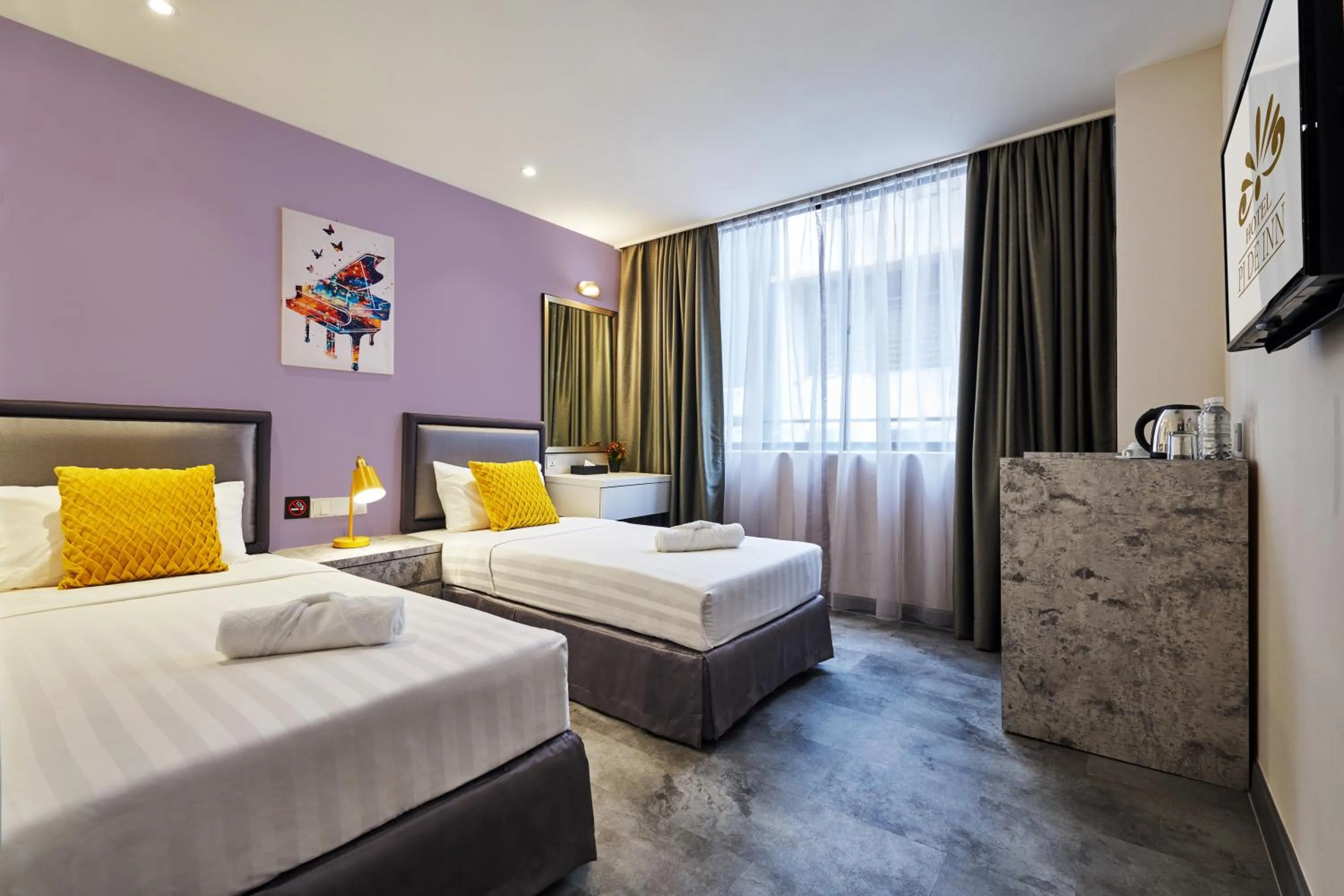 Bed in PJ De Inn Hotel