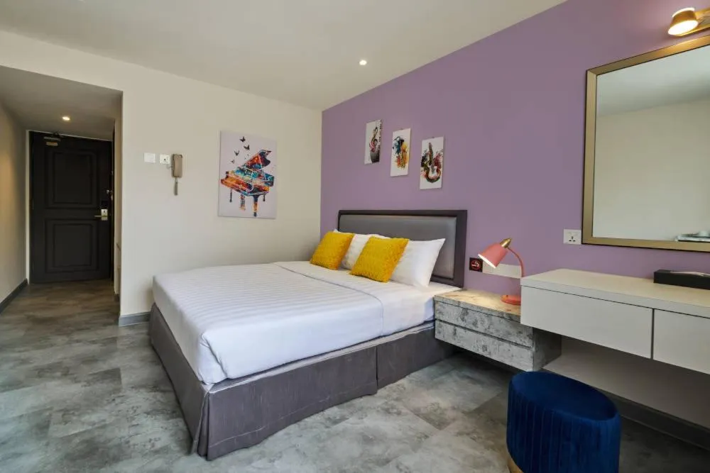 Bed in PJ De Inn Hotel