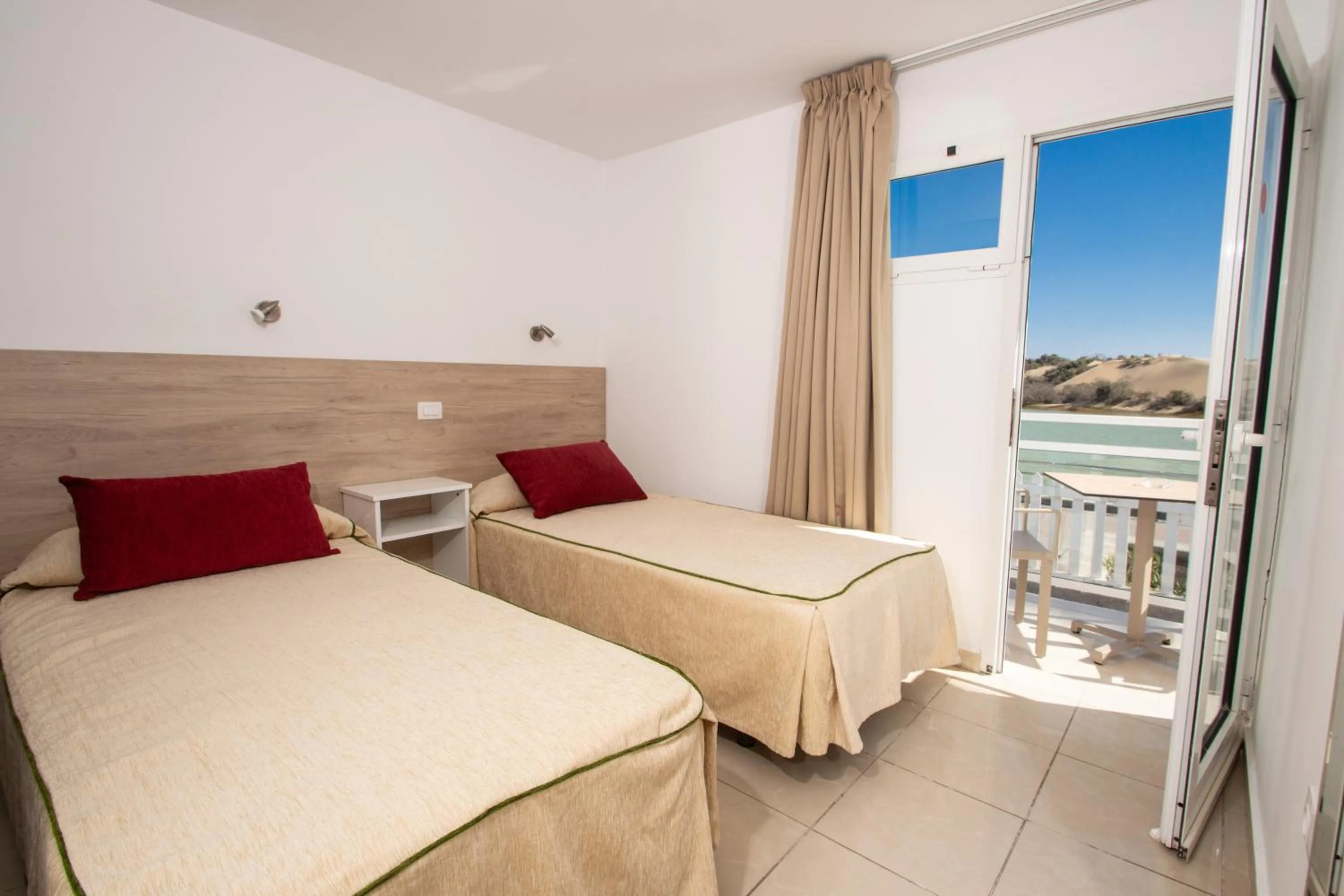 Bed in Apartamentos Cocoteros