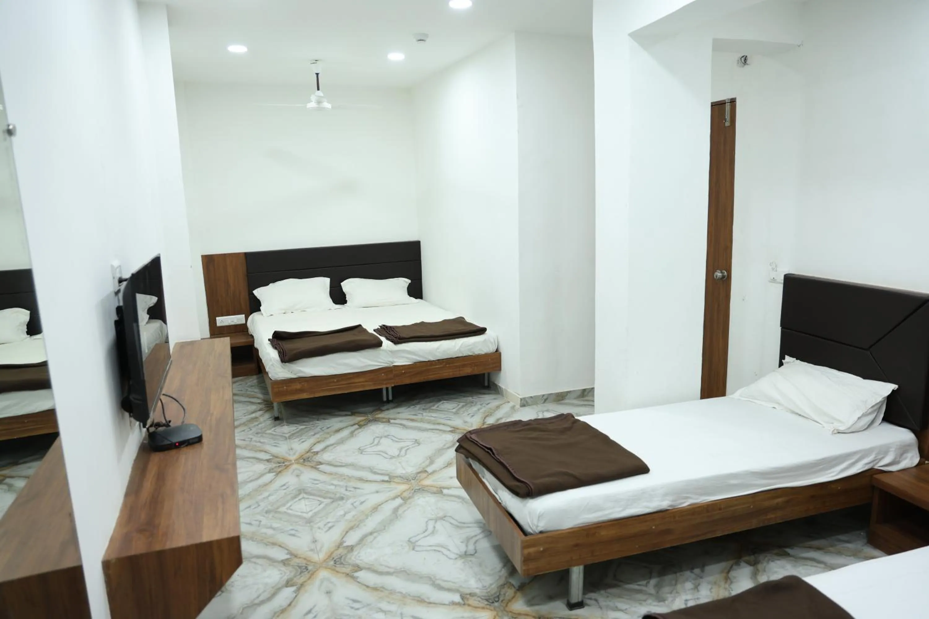 Bed in Hotel Aaram Kalupur