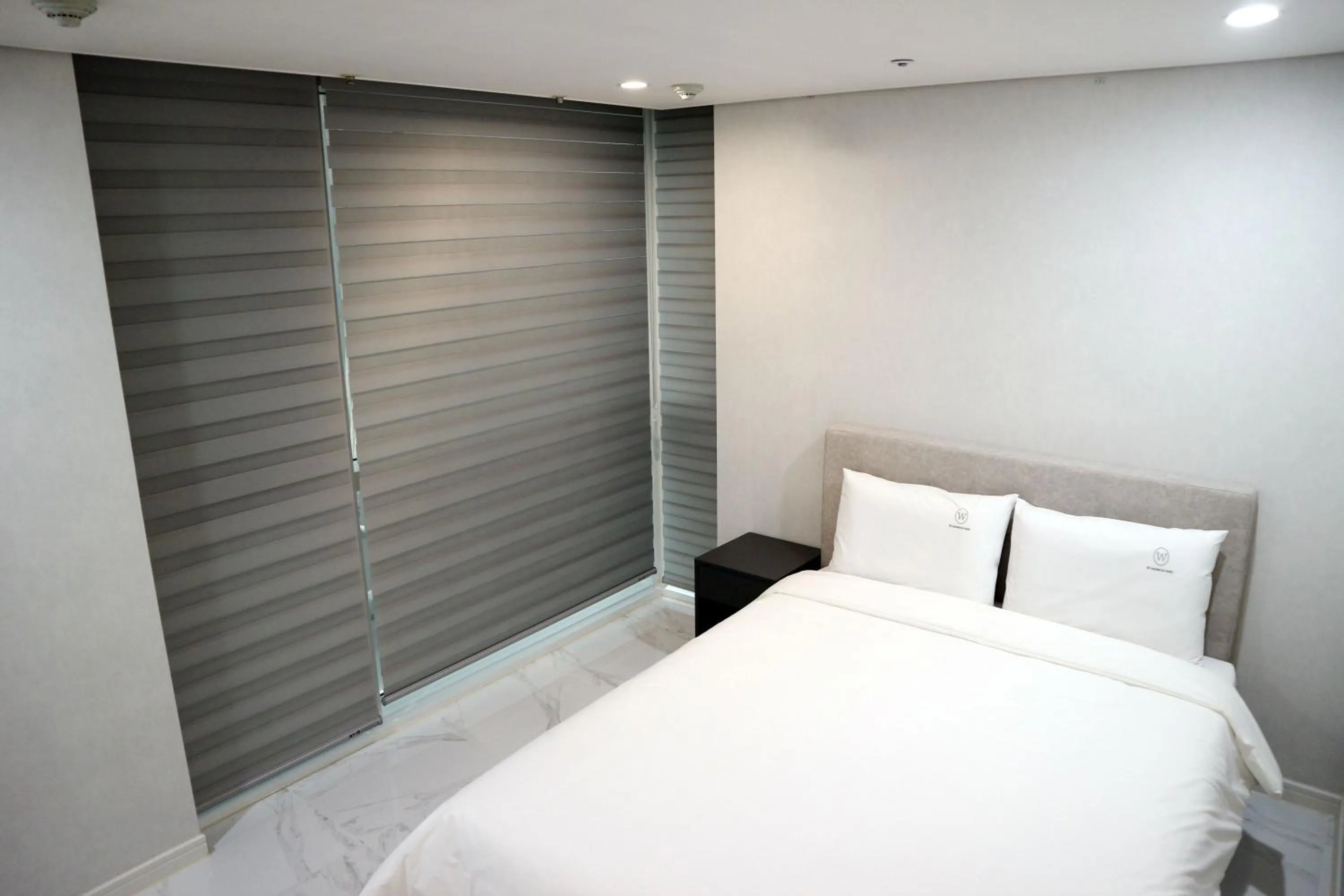 Bed in W Residence Hotel Centum City