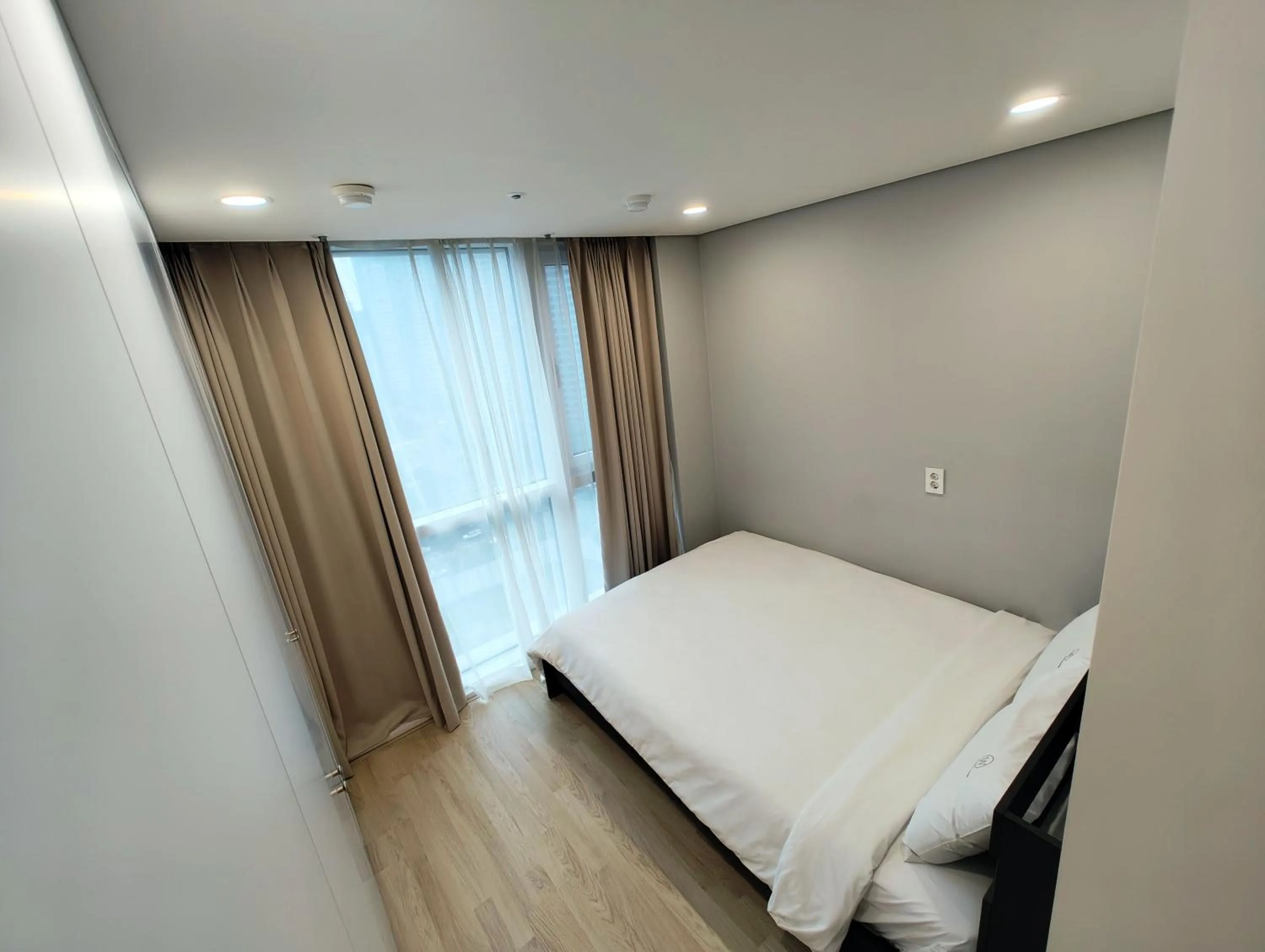 Bed in W Residence Hotel Centum City