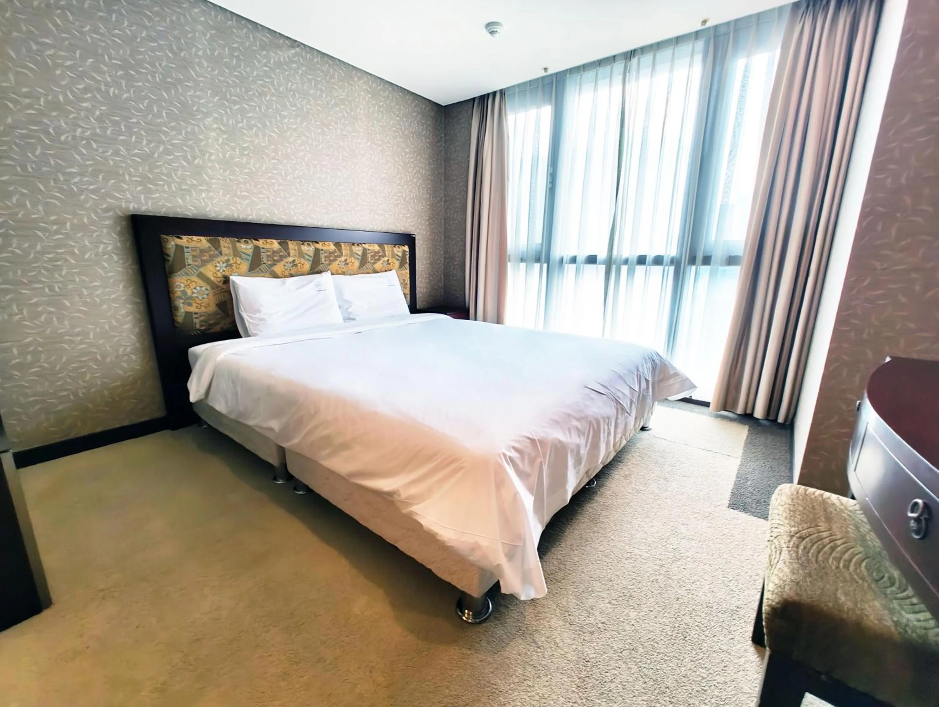 Bed in W Residence Hotel Centum City