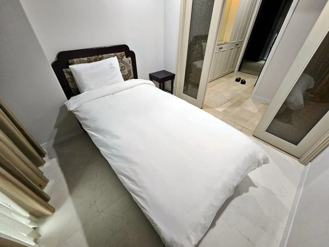 Bed in W Residence Hotel Centum City
