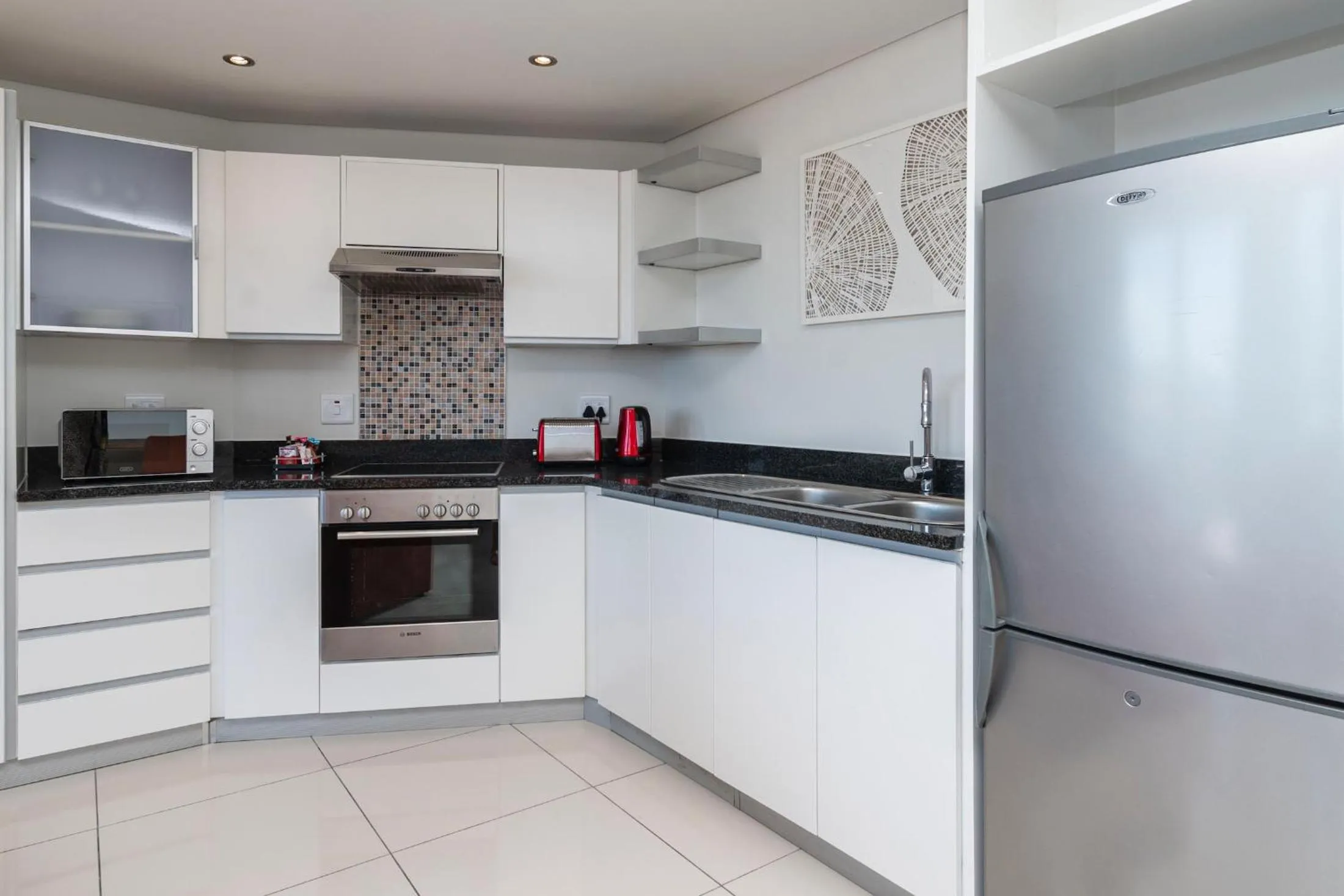 Kitchen or kitchenette in Xenia Aparthotel by Totalstay