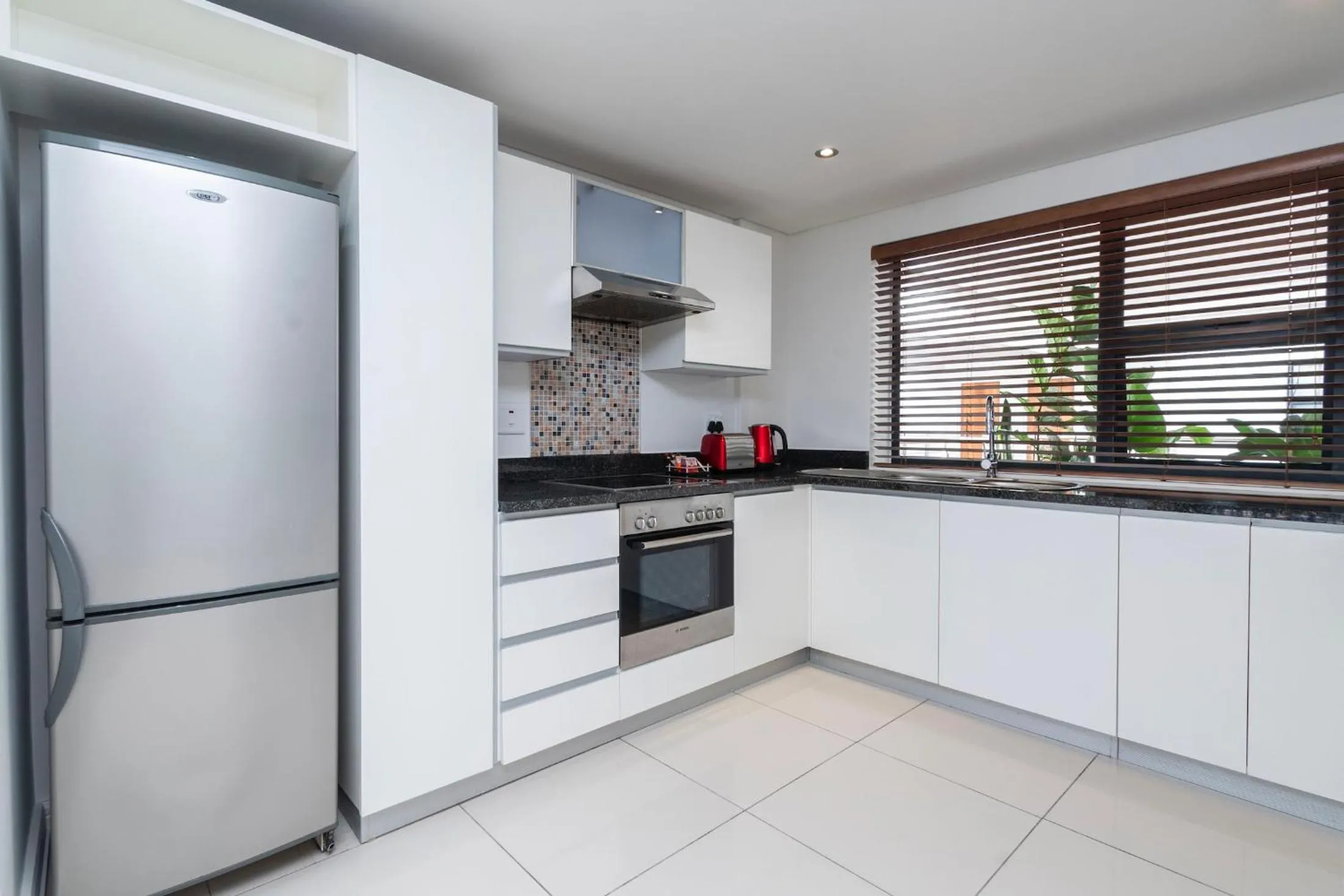 Kitchen or kitchenette in Xenia Aparthotel by Totalstay