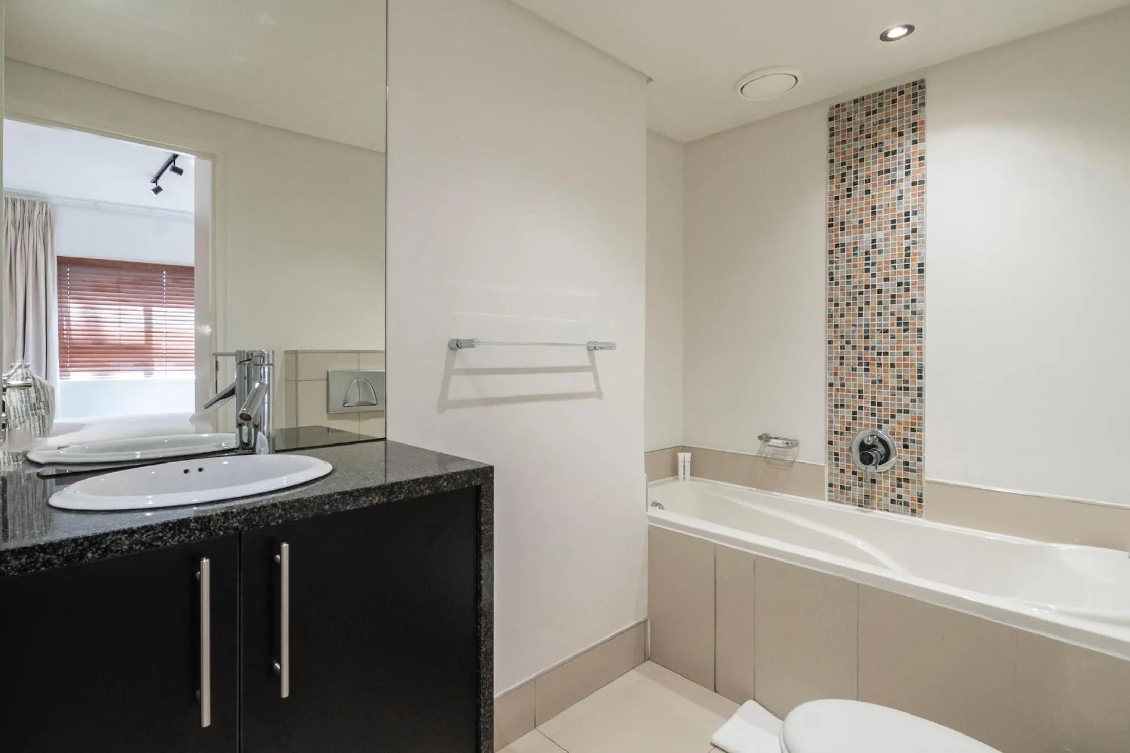 Bathroom in Xenia Aparthotel by Totalstay