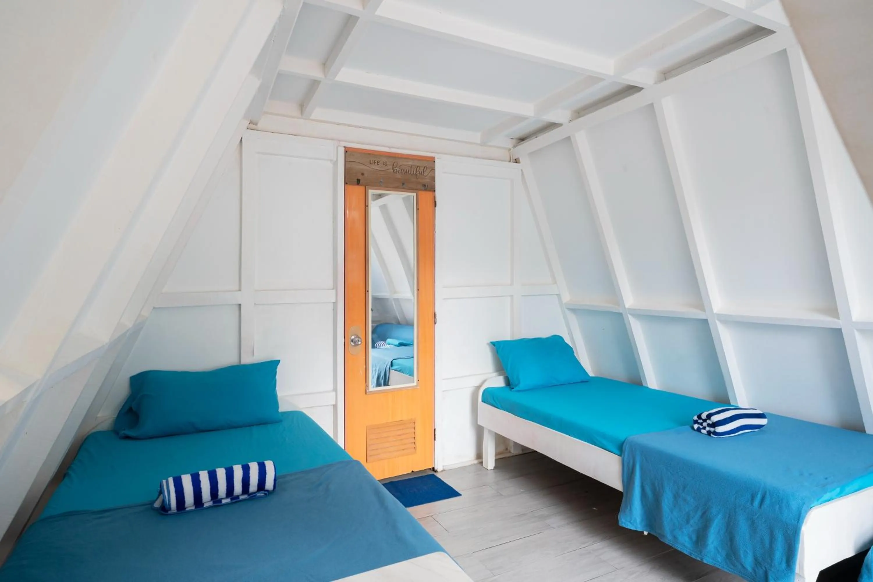 Bed in Costas De Liwa Bar & Beach Resort