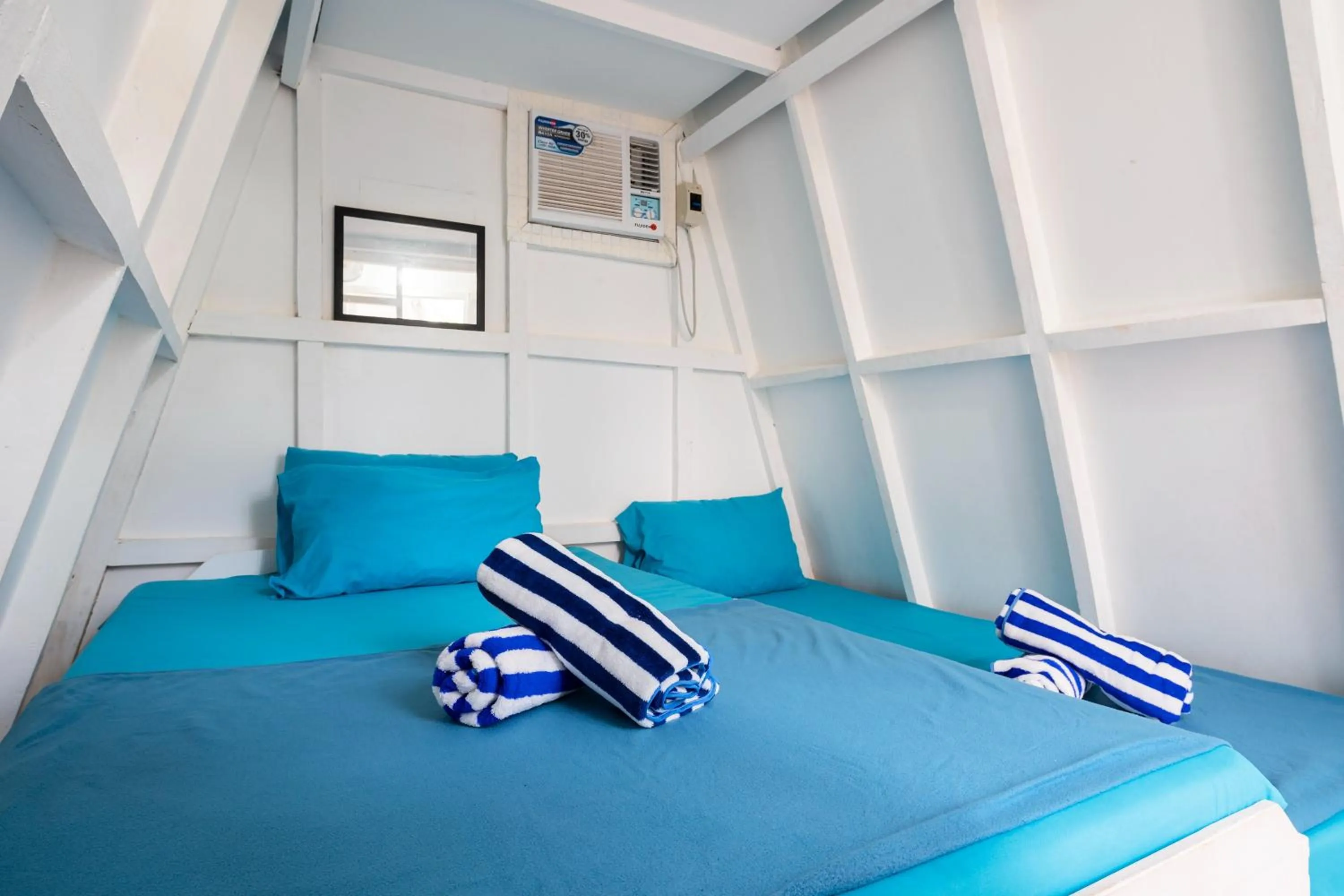 Bed in Costas De Liwa Bar & Beach Resort