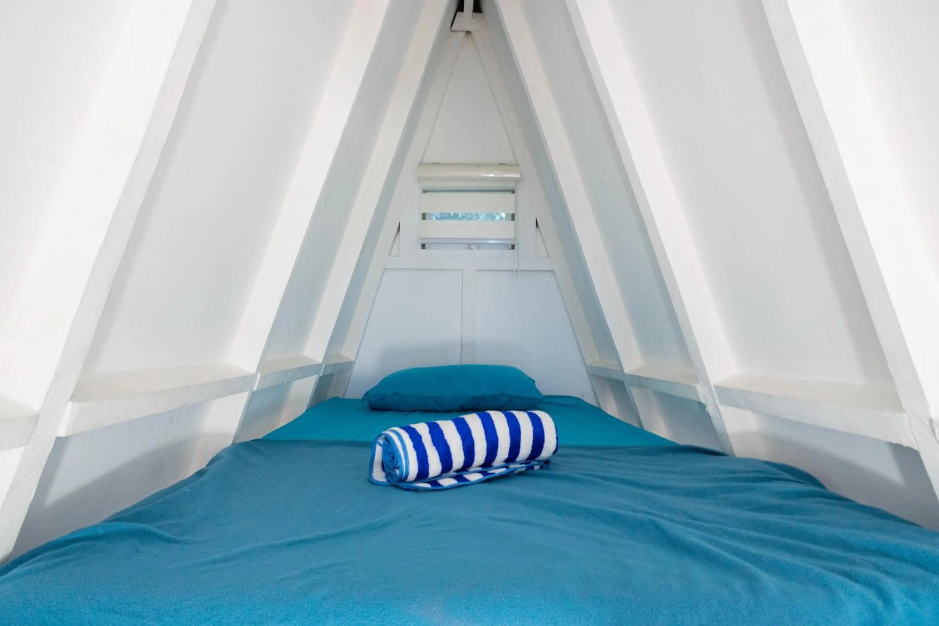 Bed in Costas De Liwa Bar & Beach Resort