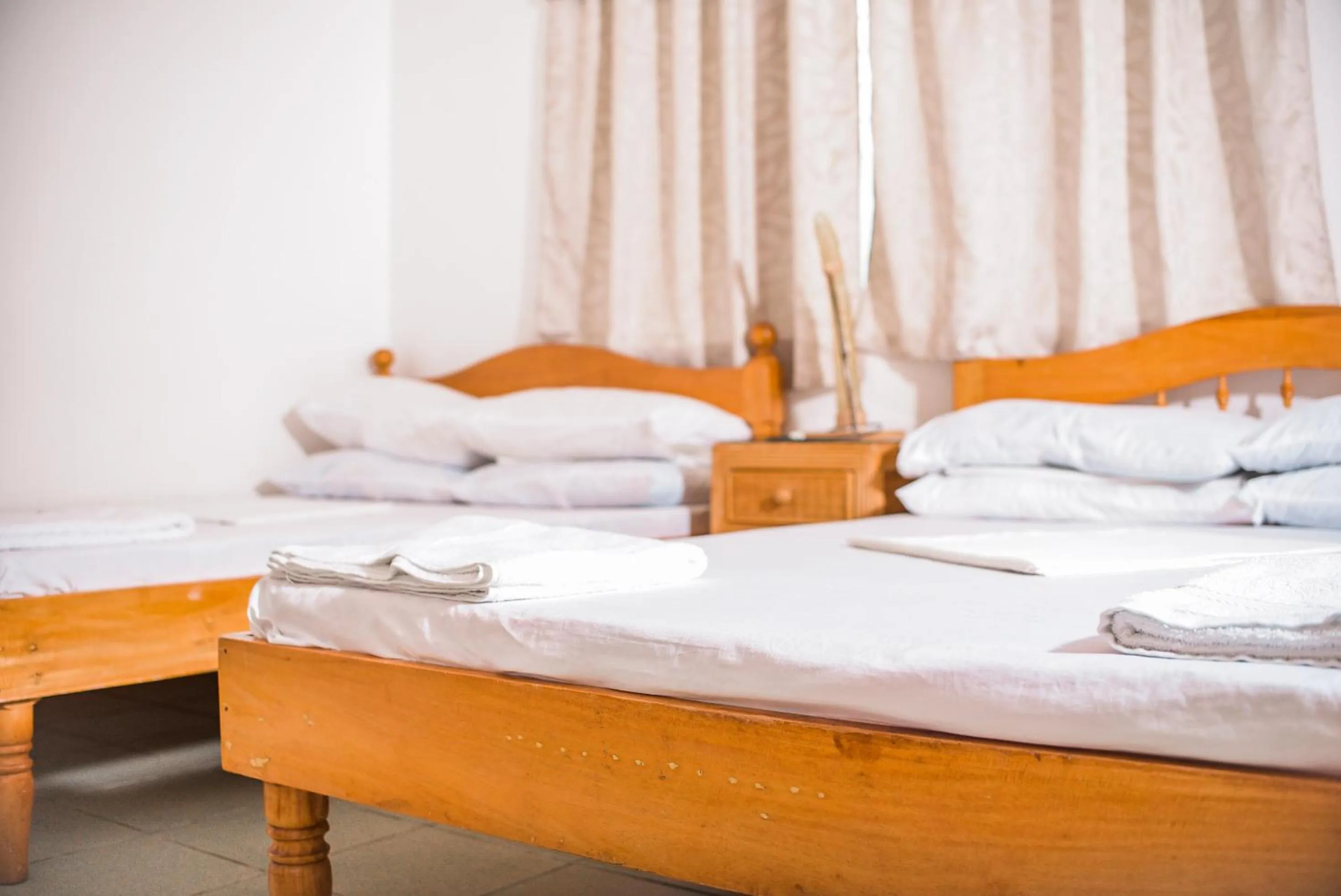 Bed in Whispering Palms Island Resort