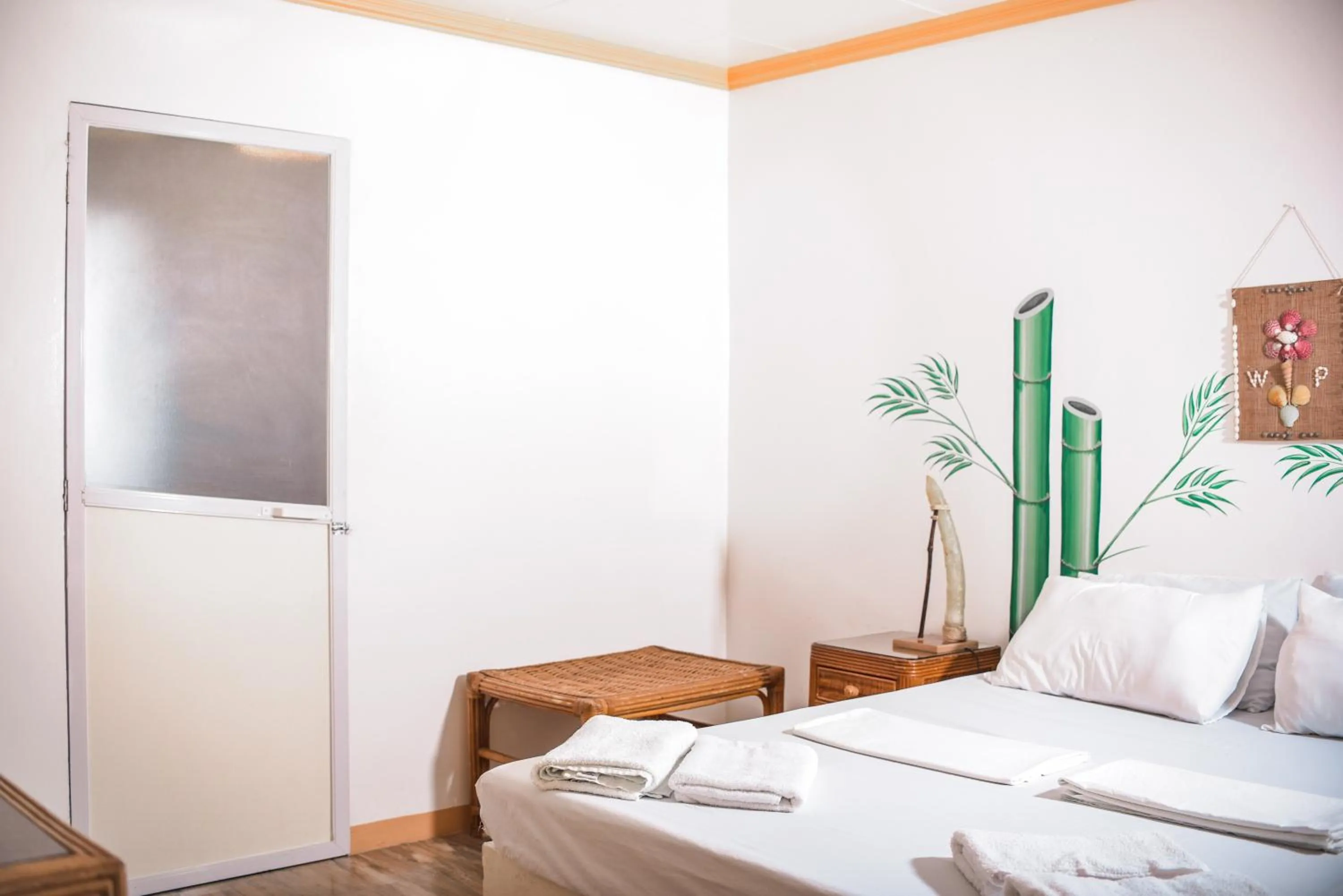 Bed in Whispering Palms Island Resort