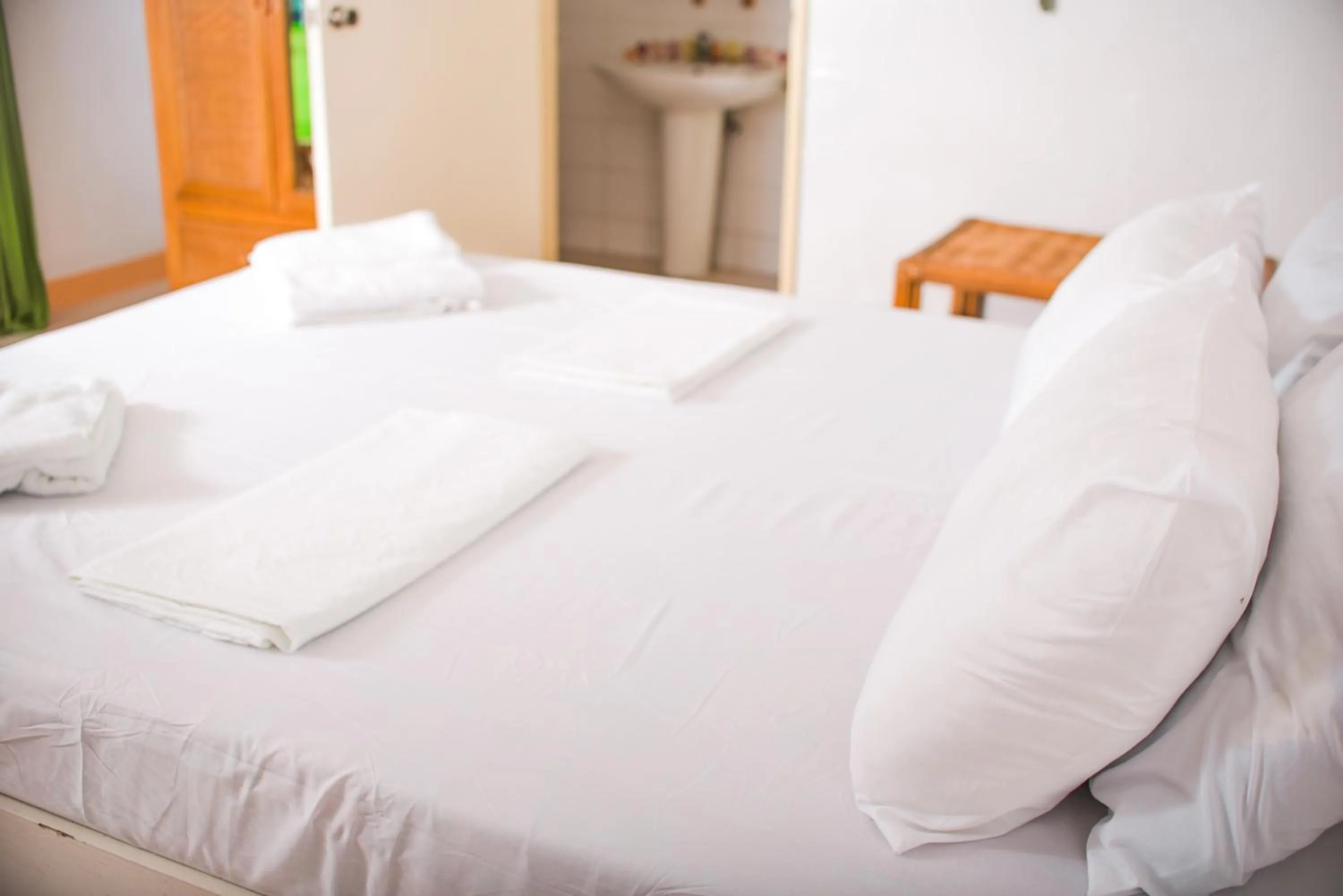 Bed in Whispering Palms Island Resort