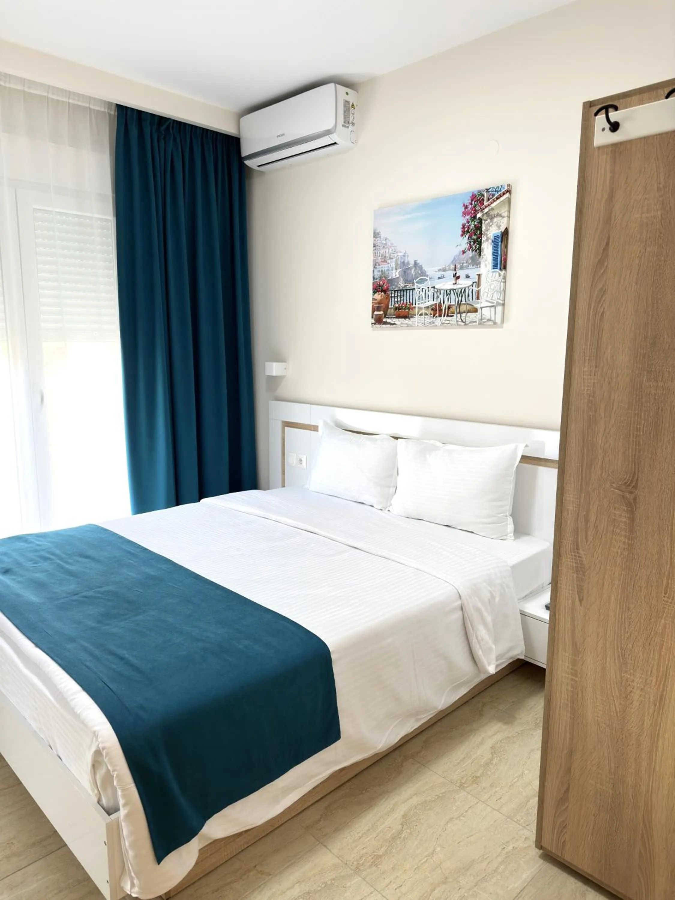 Bed in Navarino Luxe Suites