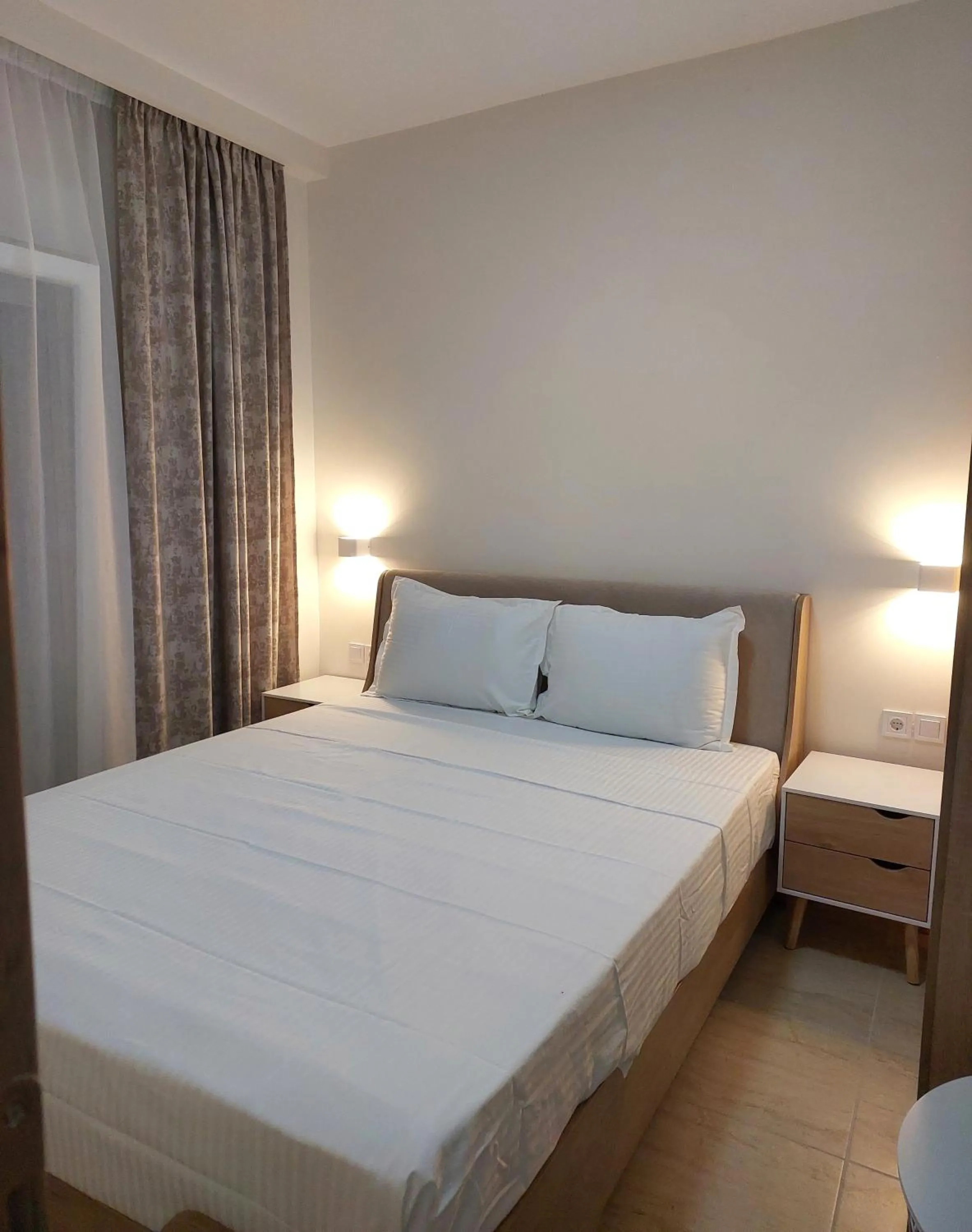 Bed in Navarino Luxe Suites