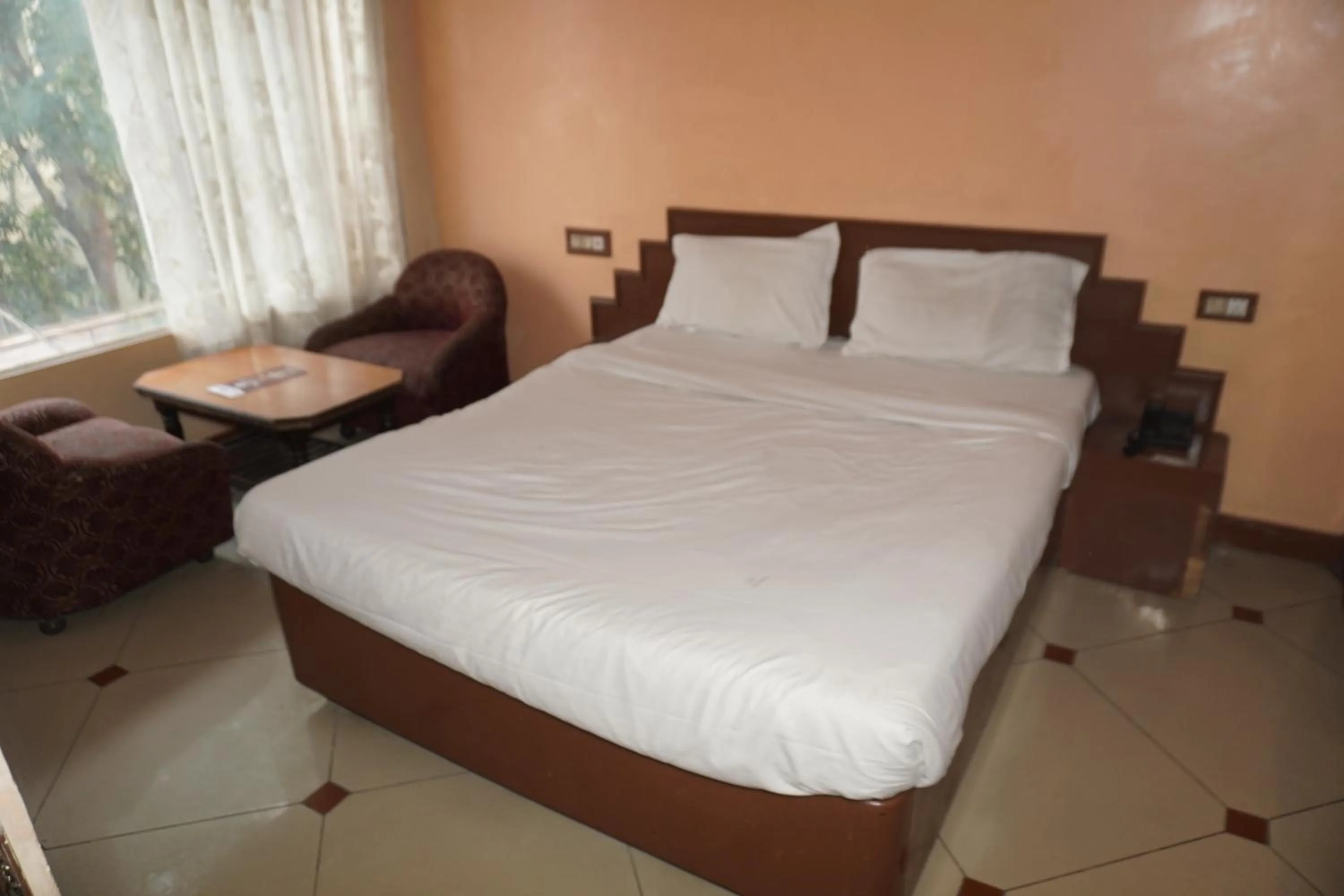 Bed in Hotel Maya international